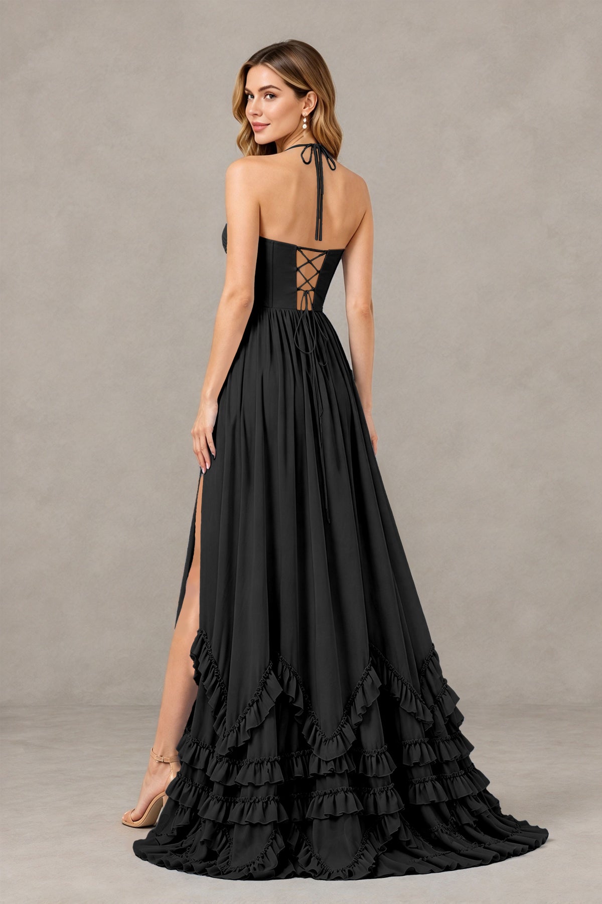 Black floor-length ruffle evening gown back view with open back and crisscross lacing