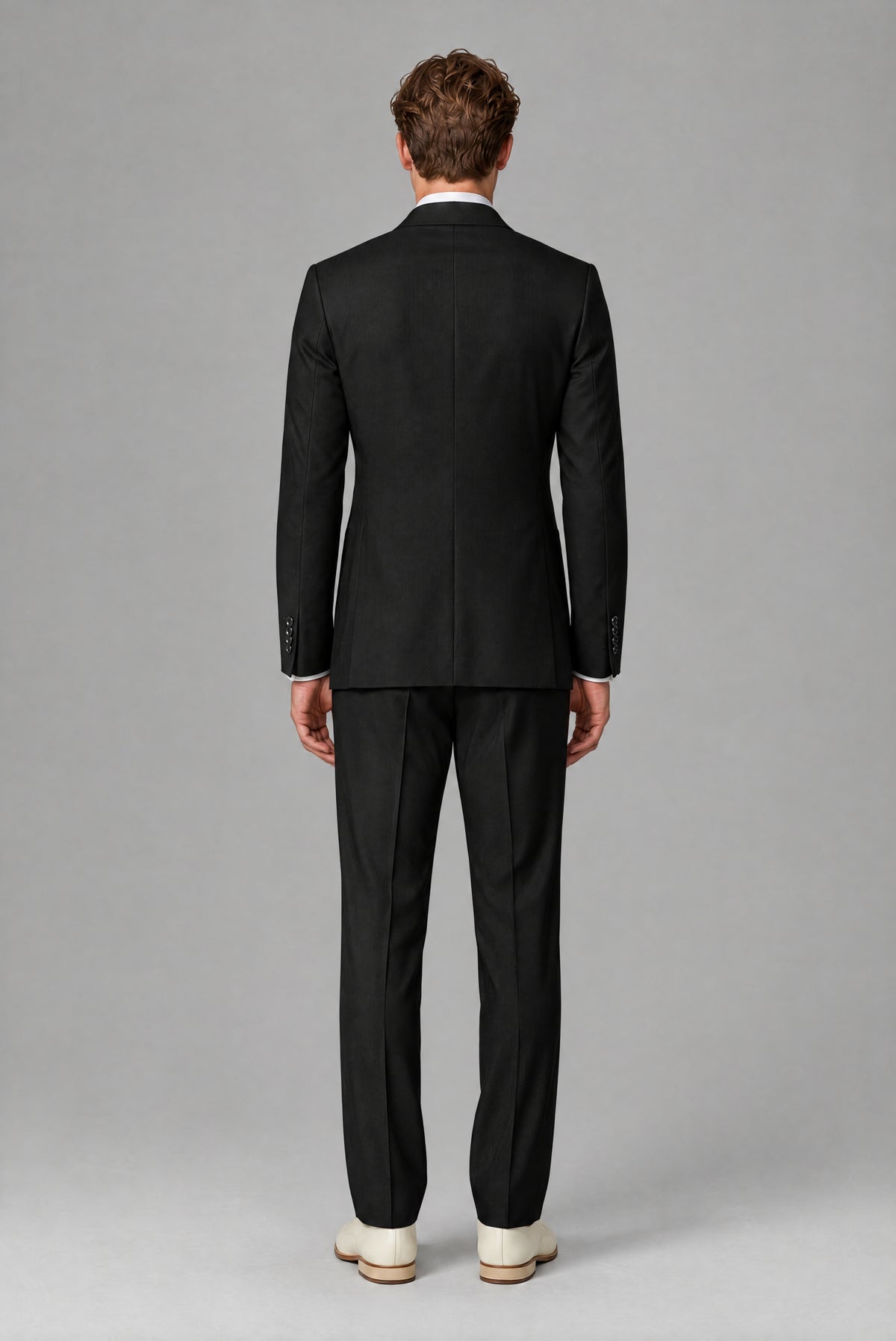 Bolodoo men's black two-piece suit showing jacket and trousers from the back