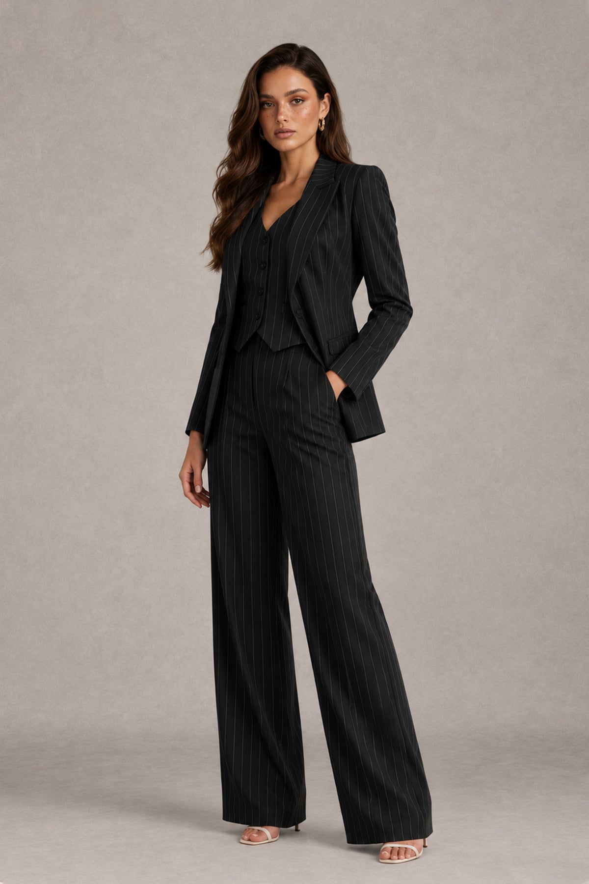 BOLODOO black pinstripe women's pantsuit three-quarter view showing tailored blazer and trouser pockets