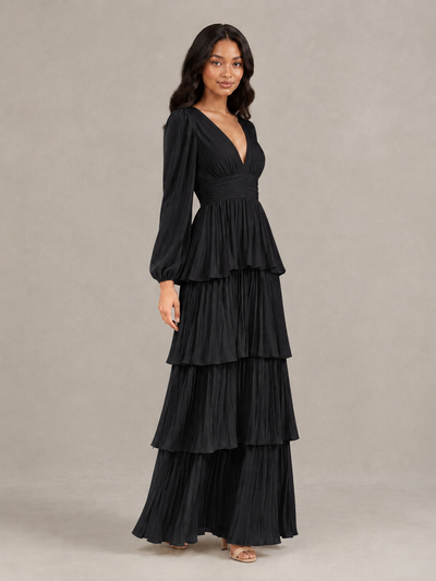 Three-quarter view of BOLODOO black long-sleeve pleated tiered maxi dress