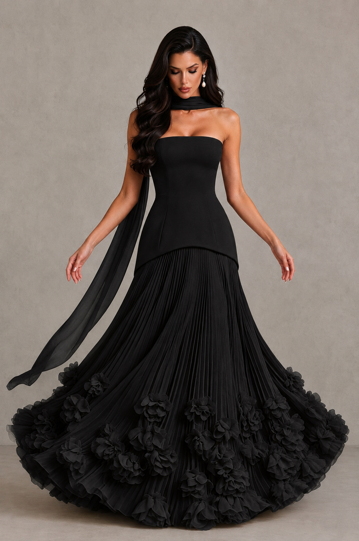 BOLODOO black floor-length evening gown showing flowing pleated skirt and floral embellishment