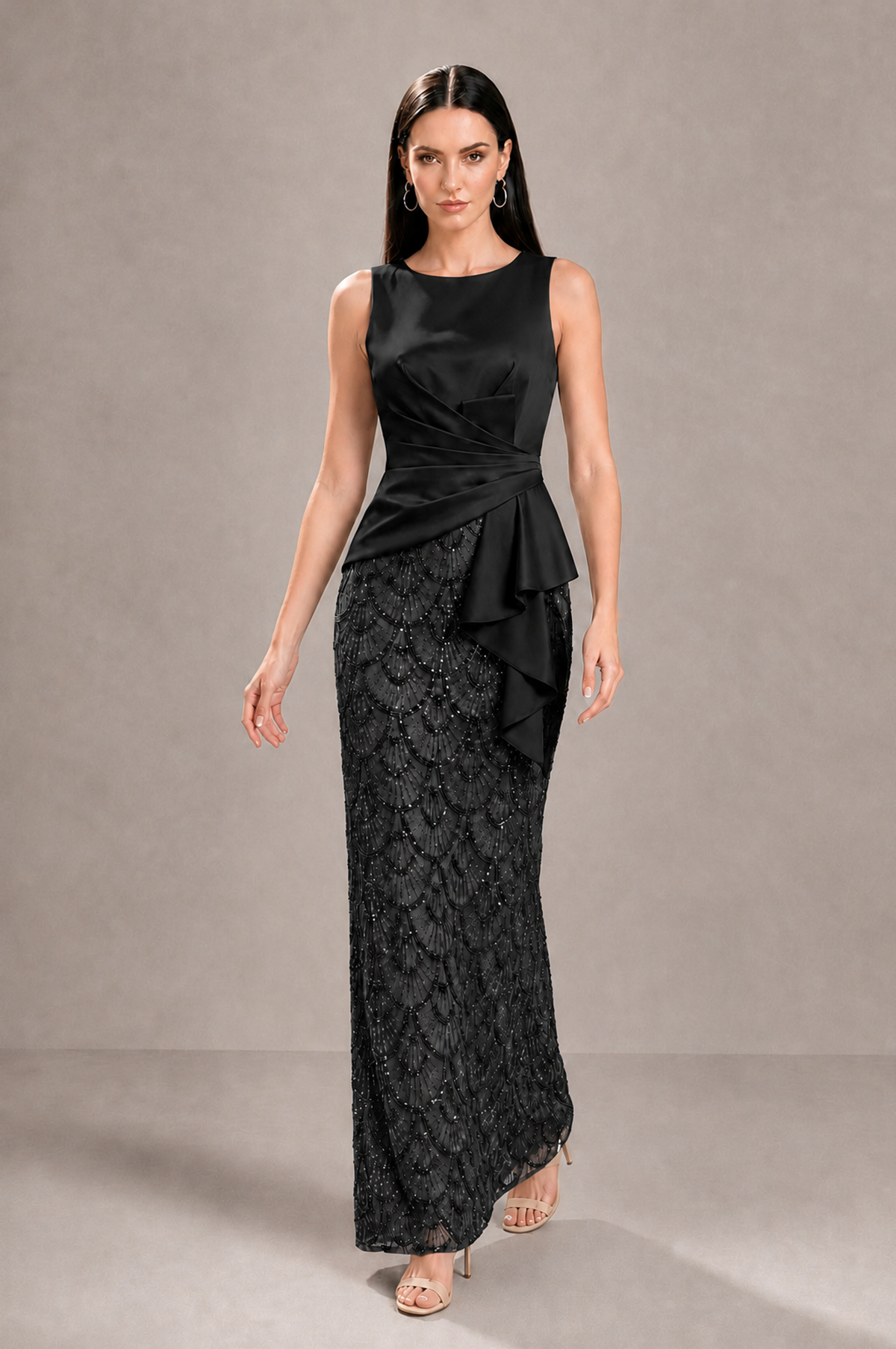 Walking front view of BOLODOO black maxi formal dress showing asymmetric peplum and textured skirt
