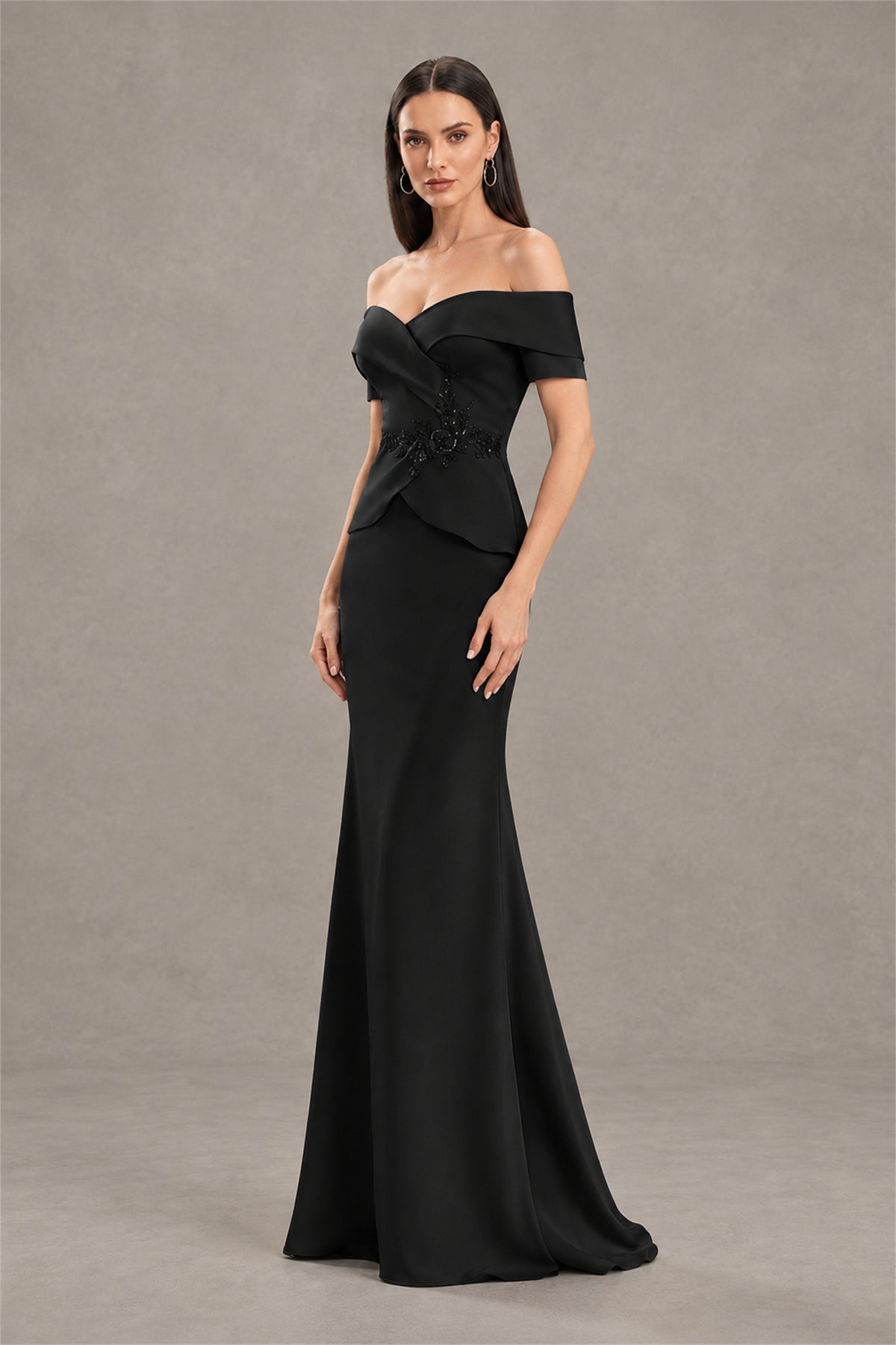Back view of black floor length off shoulder formal gown with covered back