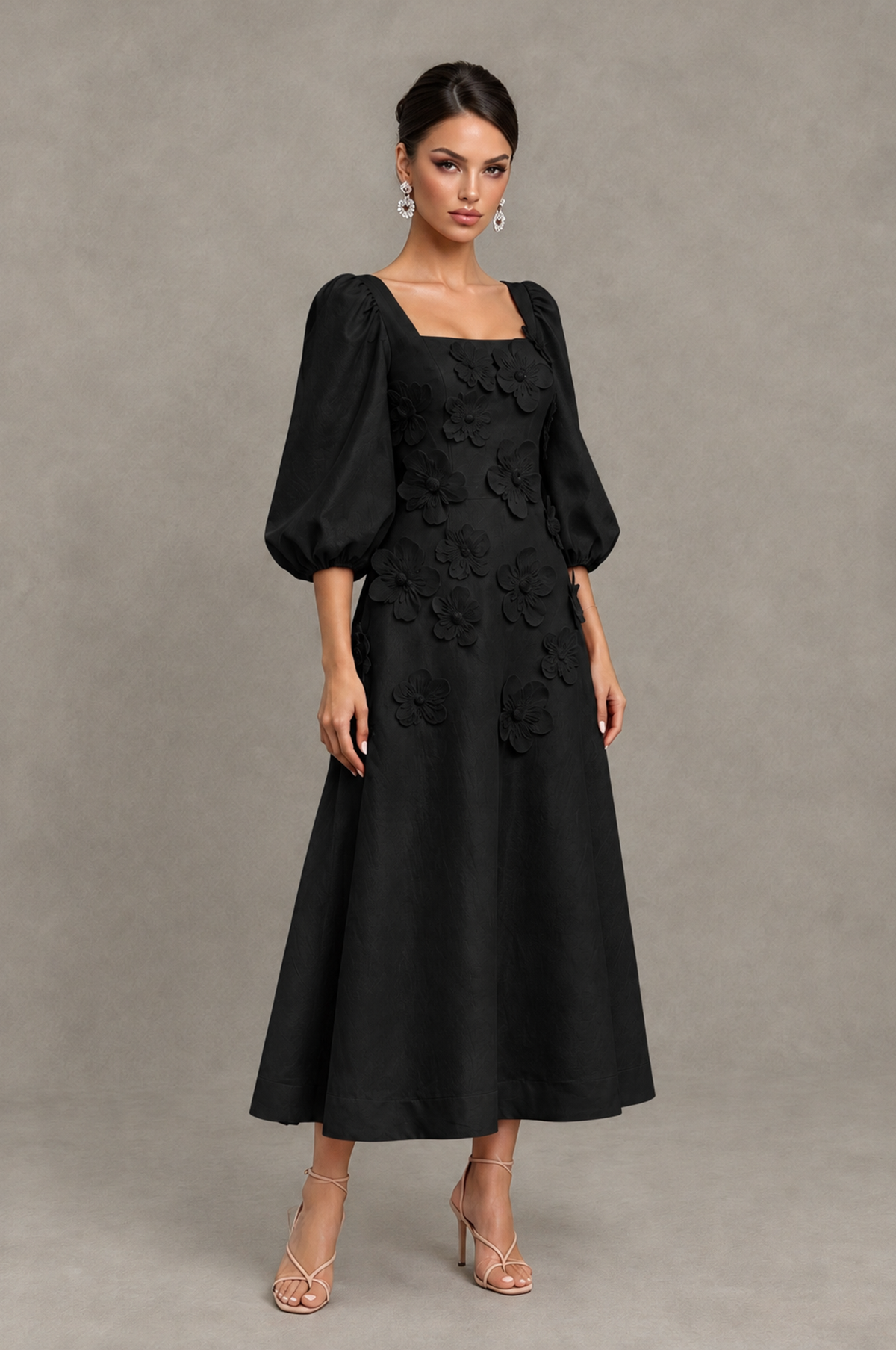 Black square-neck A-line cocktail dress three-quarter front view with floral appliques