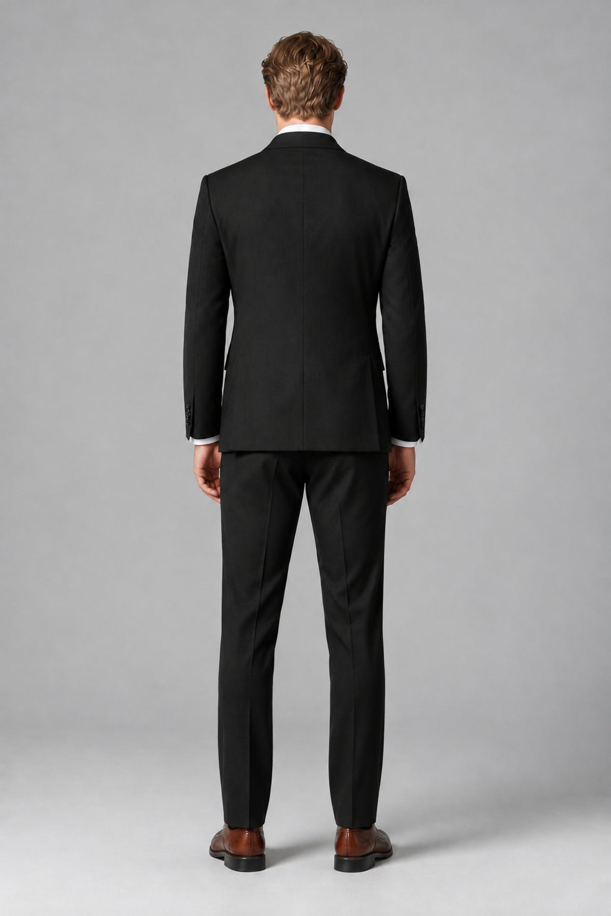 Bolodoo black suit jacket and matching full-length trousers, side view