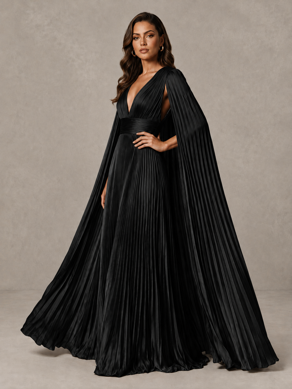 BOLODOO black cape sleeve evening dress, angled view of pleated skirt and ruched waistband