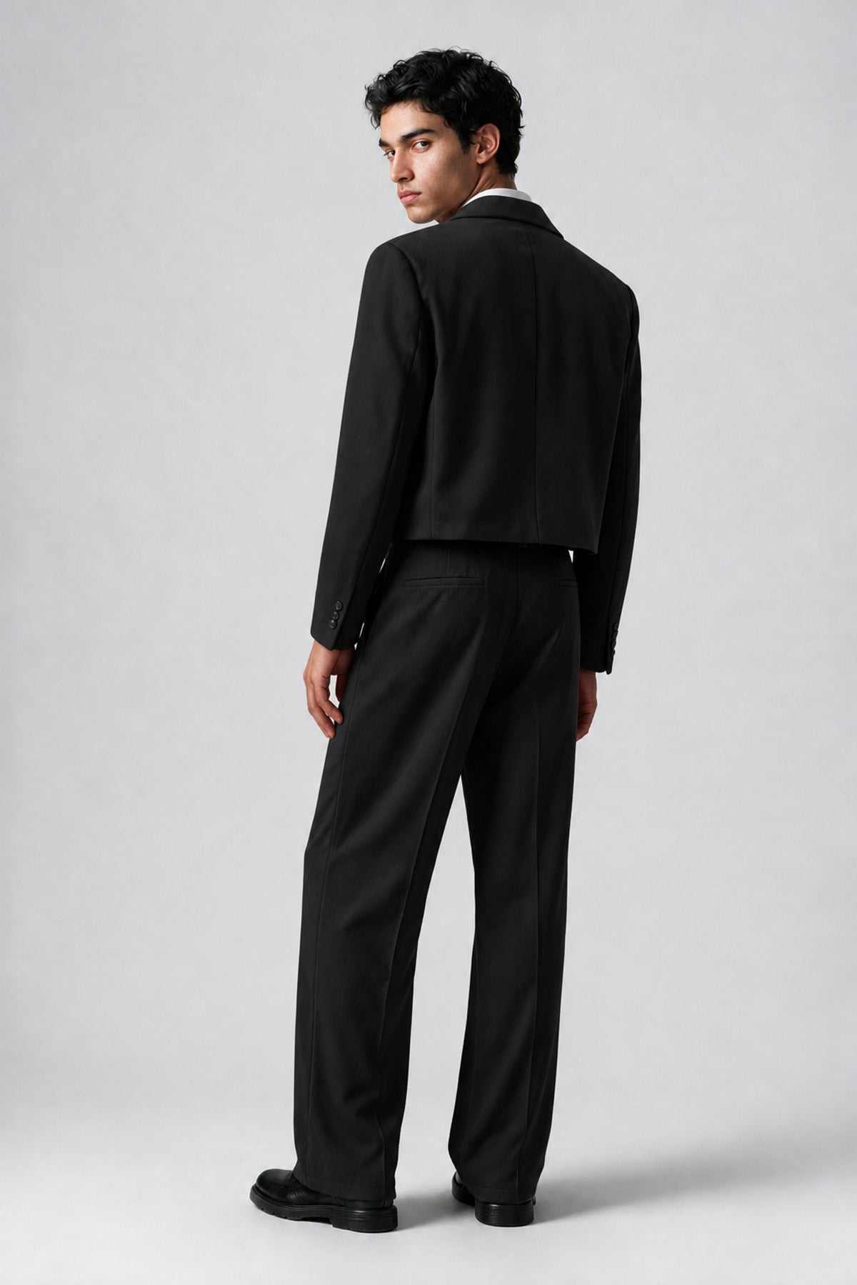 Bolodoo men's black cropped jacket and pleated wide-leg pants suit, three-quarter front view
