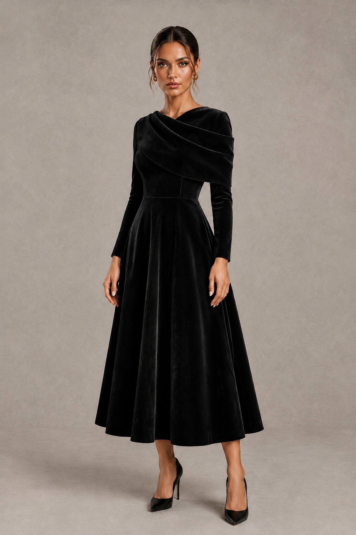 BOLODOO black tea-length occasion dress, three-quarter front view showing defined waist and flared skirt