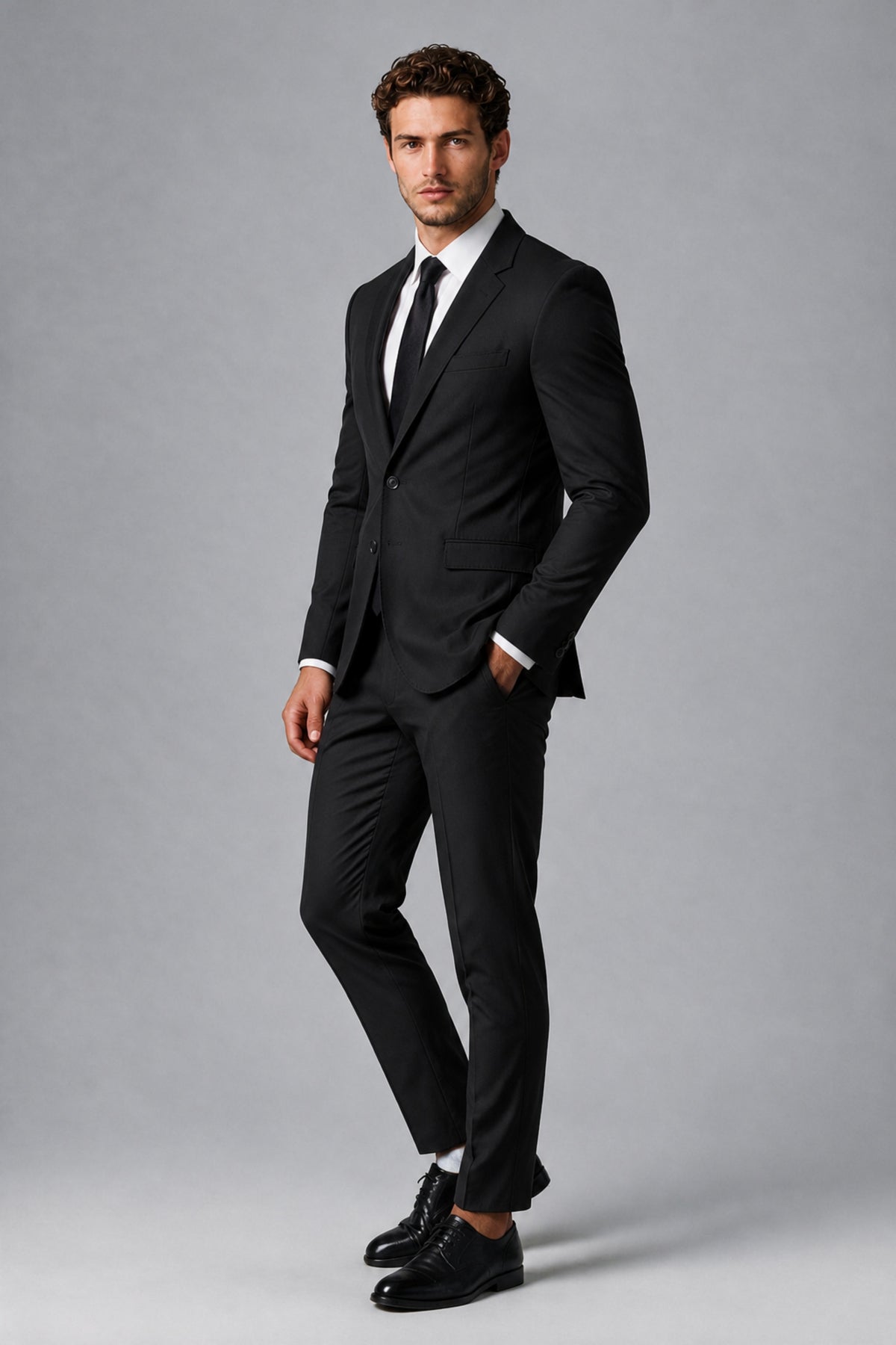 Bolodoo FQ1008 black men's suit, angled full-length view of jacket and tapered trousers