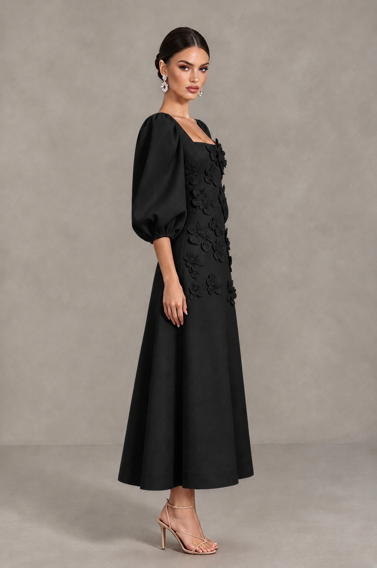 BOLODOO black midi cocktail dress side view showing puff sleeves and flared skirt