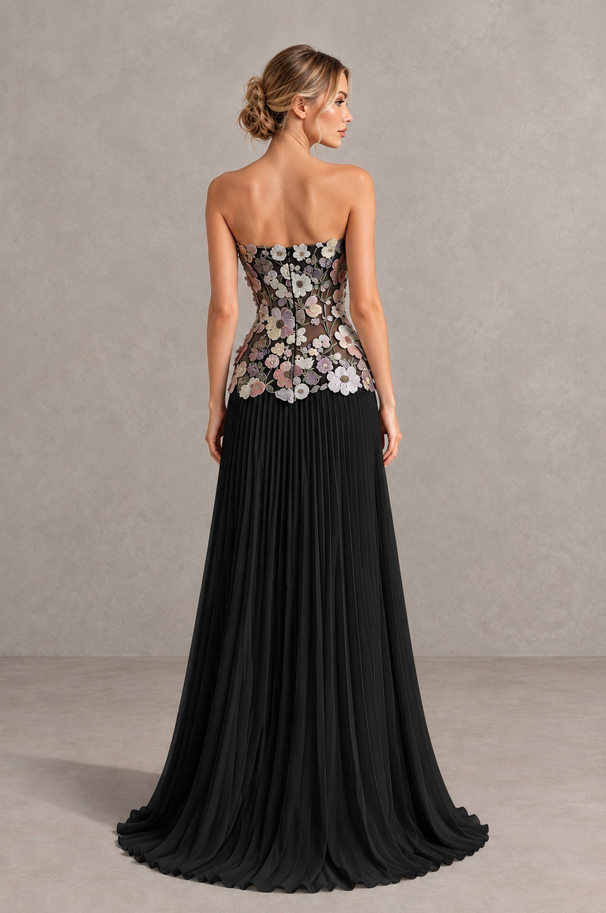 Rear view of Black Blue strapless floral evening dress with fitted bodice and pleated skirt