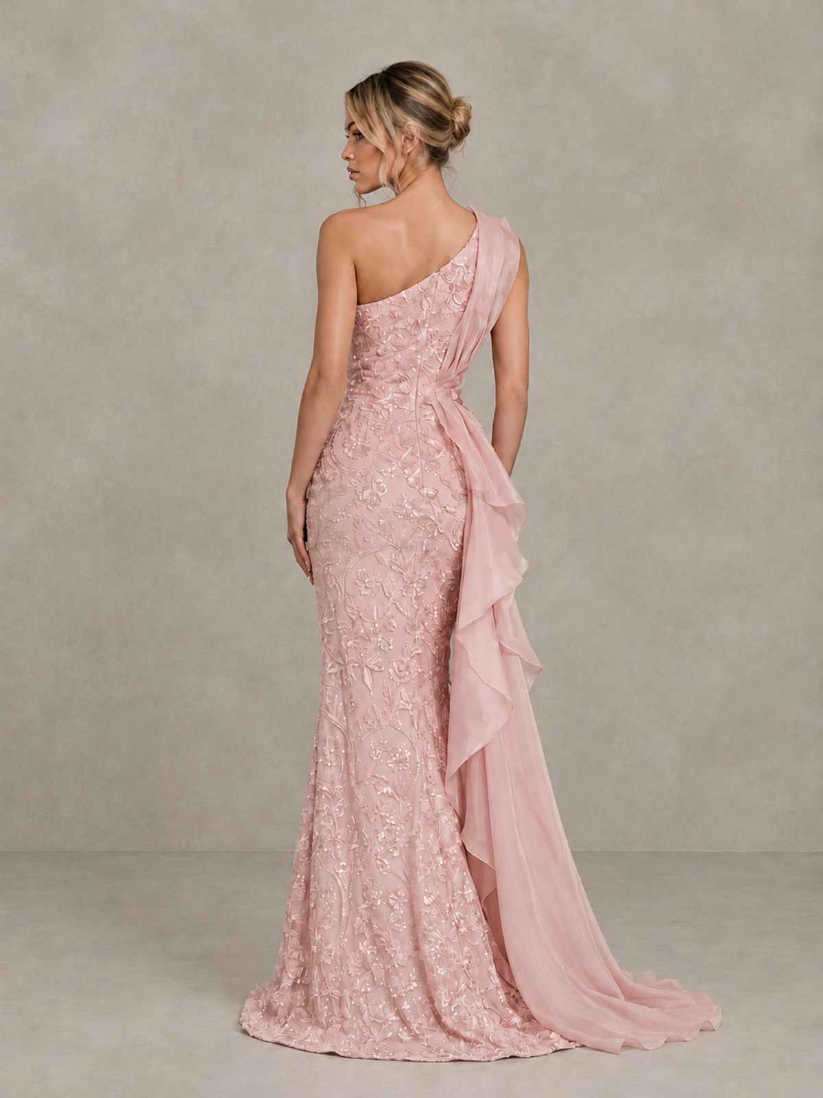 BOLODOO blush pink evening gown, back view showing diagonal neckline and cascading side train