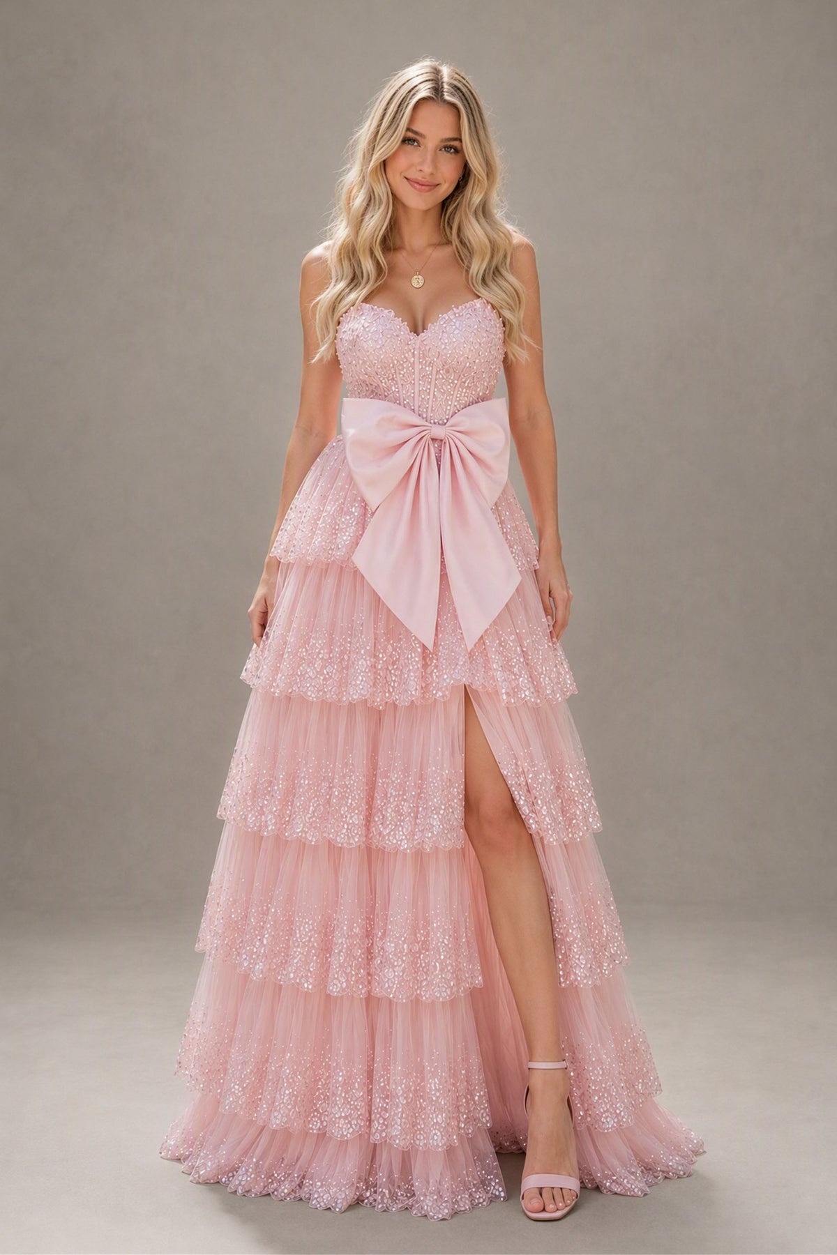 BOLODOO blush pink strapless tiered tulle prom dress with waist bow and high slit, front view