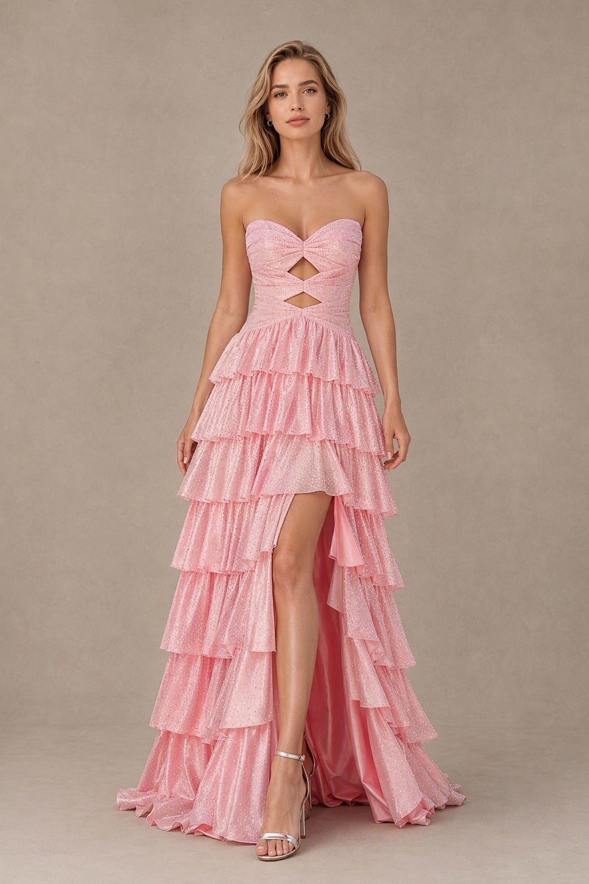 BOLODOO blush pink strapless tiered ruffle prom dress with front cutouts and high slit, front view