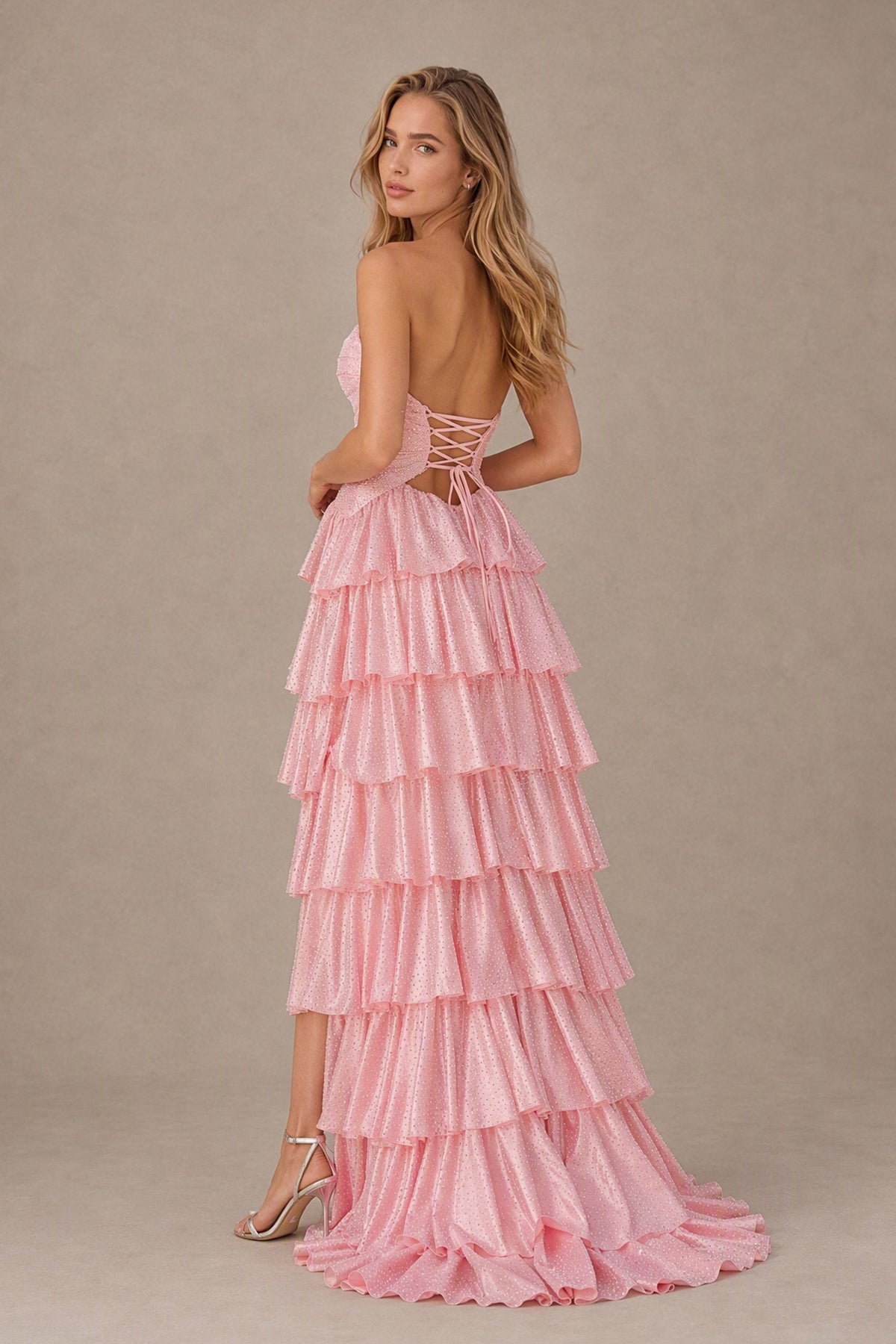 BOLODOO blush pink strapless ruffle gown with open back and crisscross lace-up ties, back view