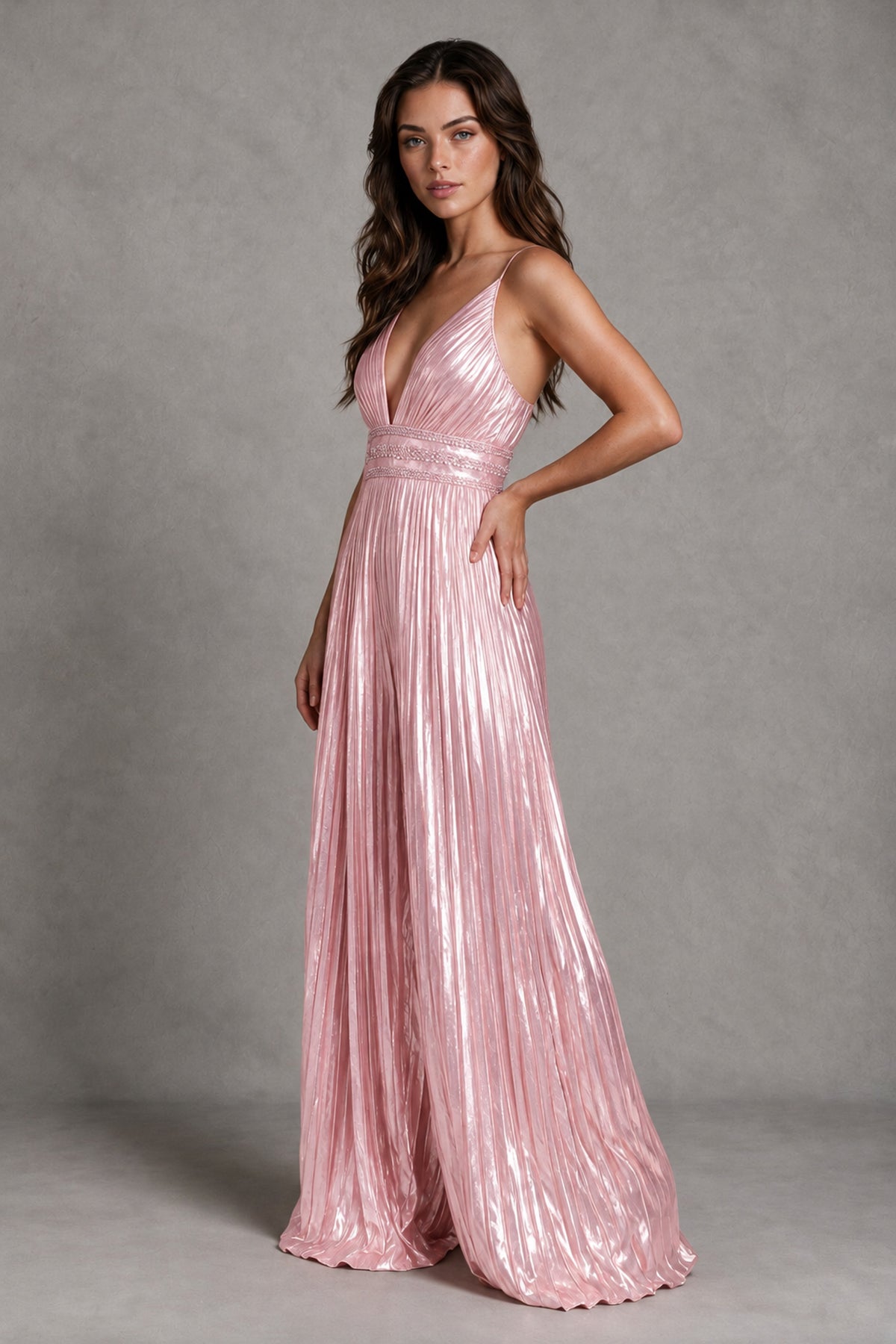 Three-quarter view of BOLODOO blush pink shimmering pleated full-length jumpsuit
