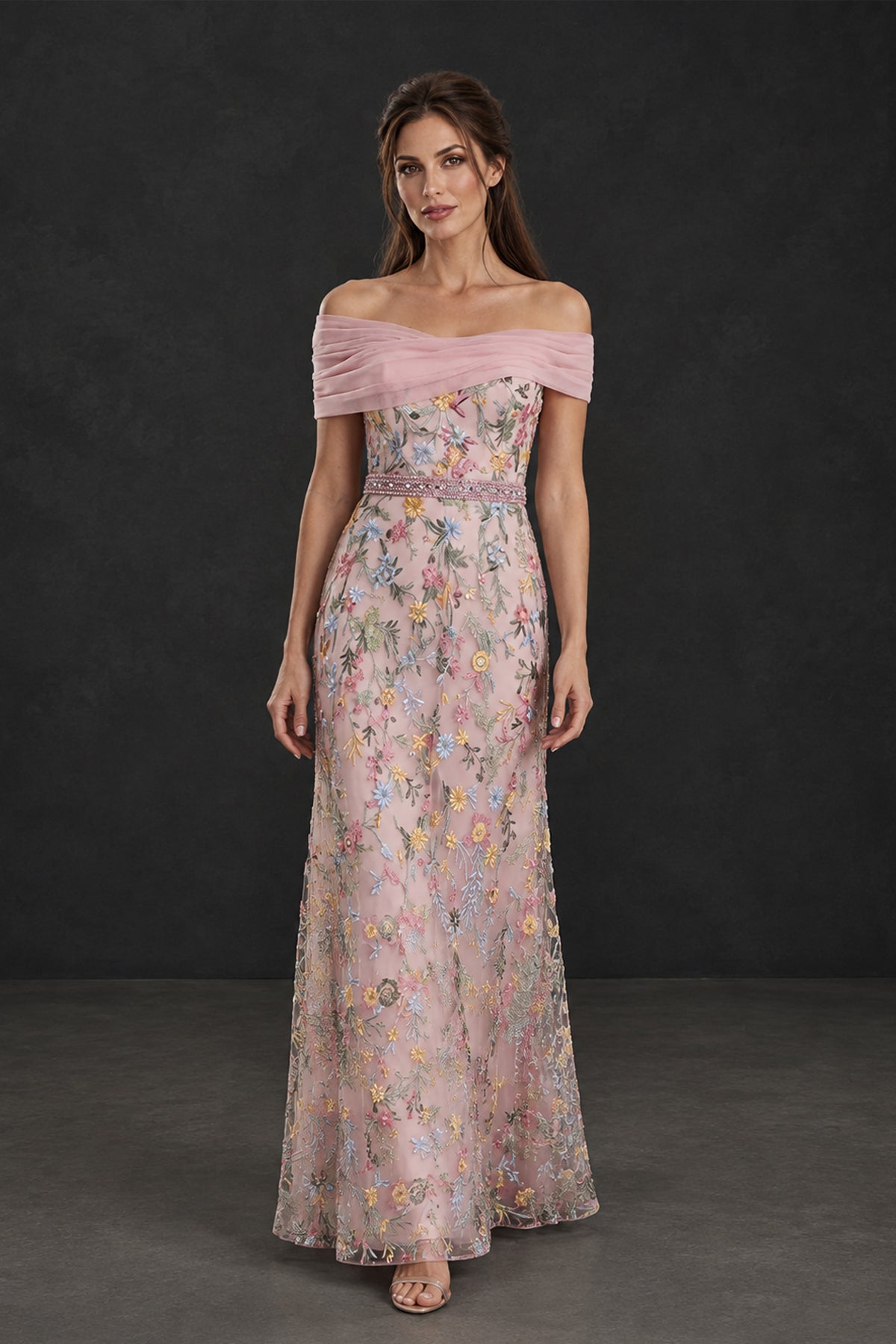BOLODOO blush pink floral formal gown, front walking pose showing floor-length skirt and pleated neckline