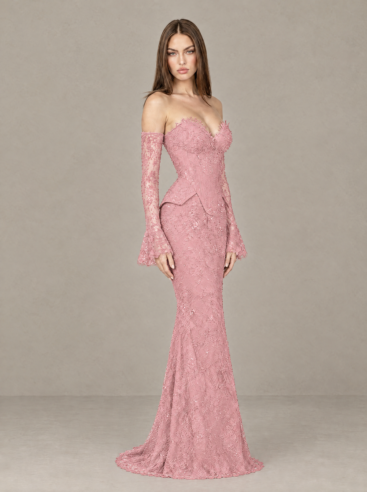BOLODOO blush pink floral lace evening gown, angled view showing peplum waist and trailing hem