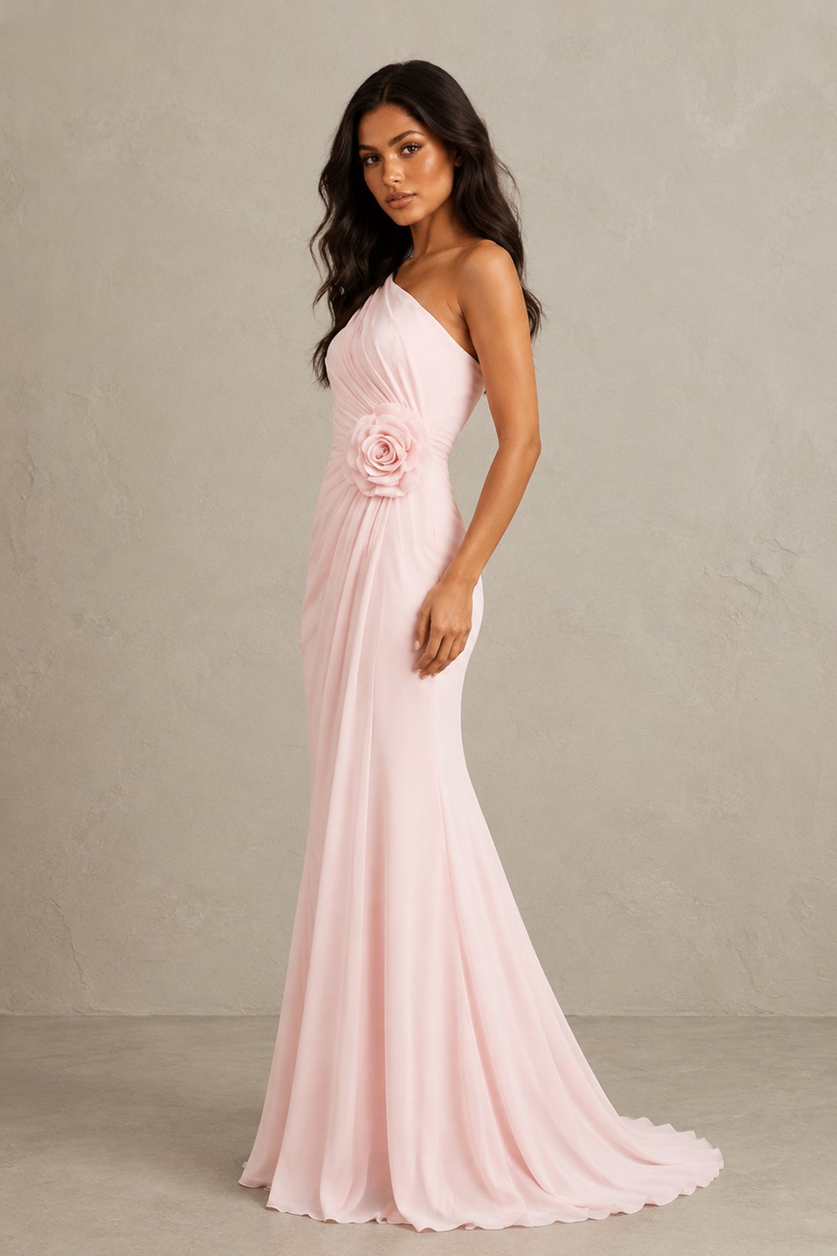 Side view of BOLODOO blush pink one-shoulder formal gown with flowing sweep train