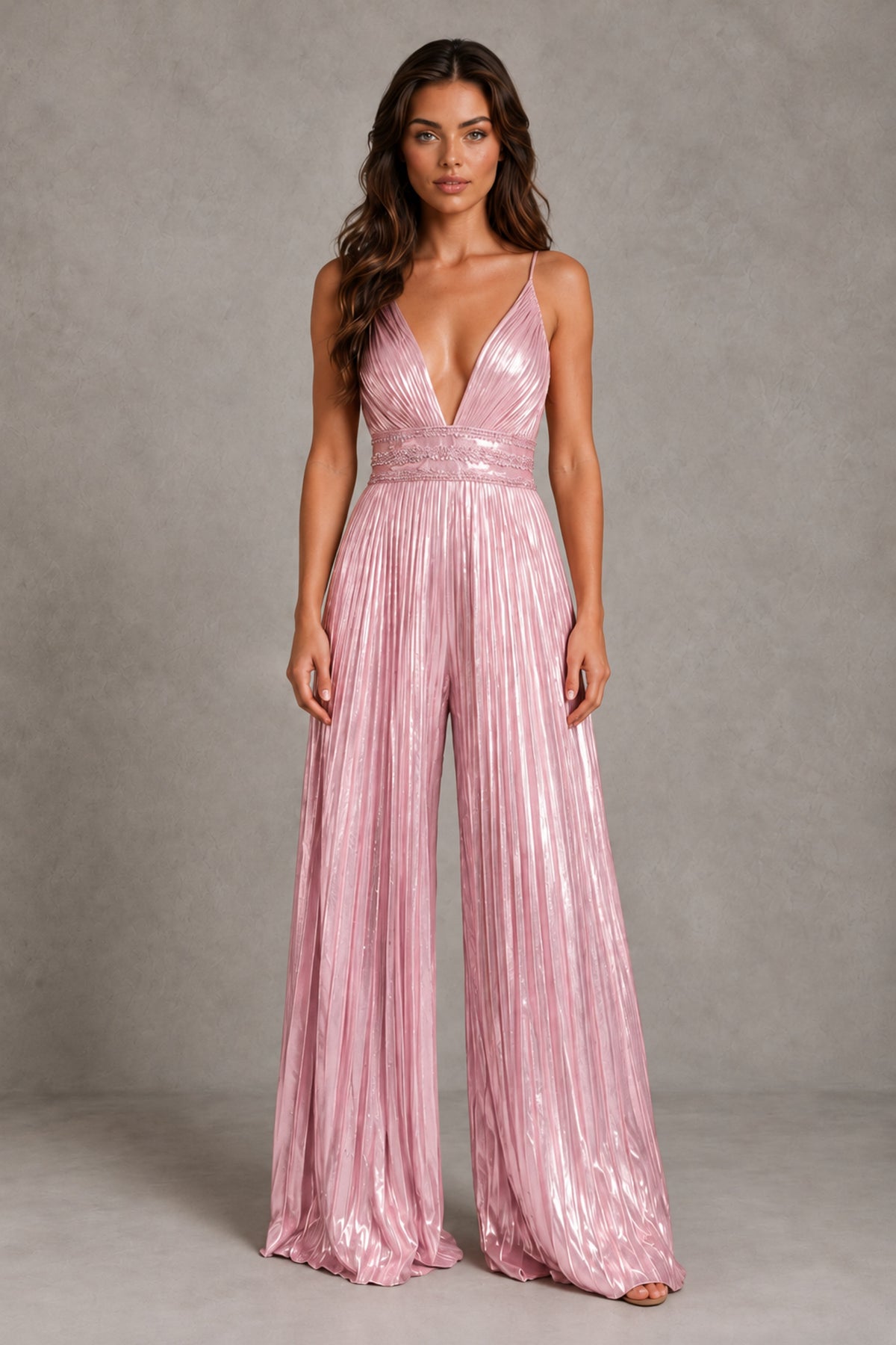 Front view of BOLODOO blush pink sleeveless jumpsuit with embellished waist and pleated wide legs