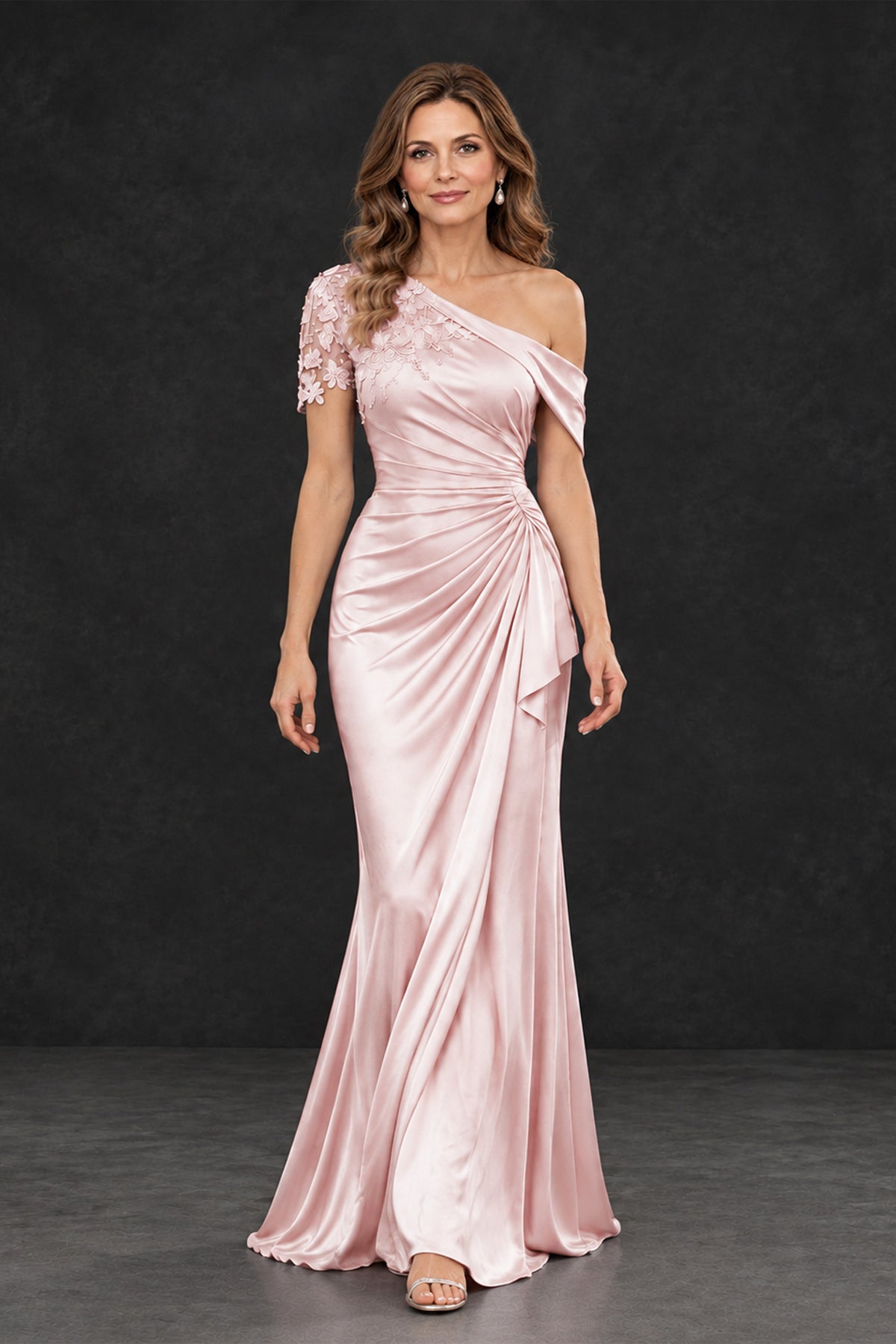 BOLODOO blush pink formal wedding guest gown, walking front view showing ruched waist and floor-length draped skirt