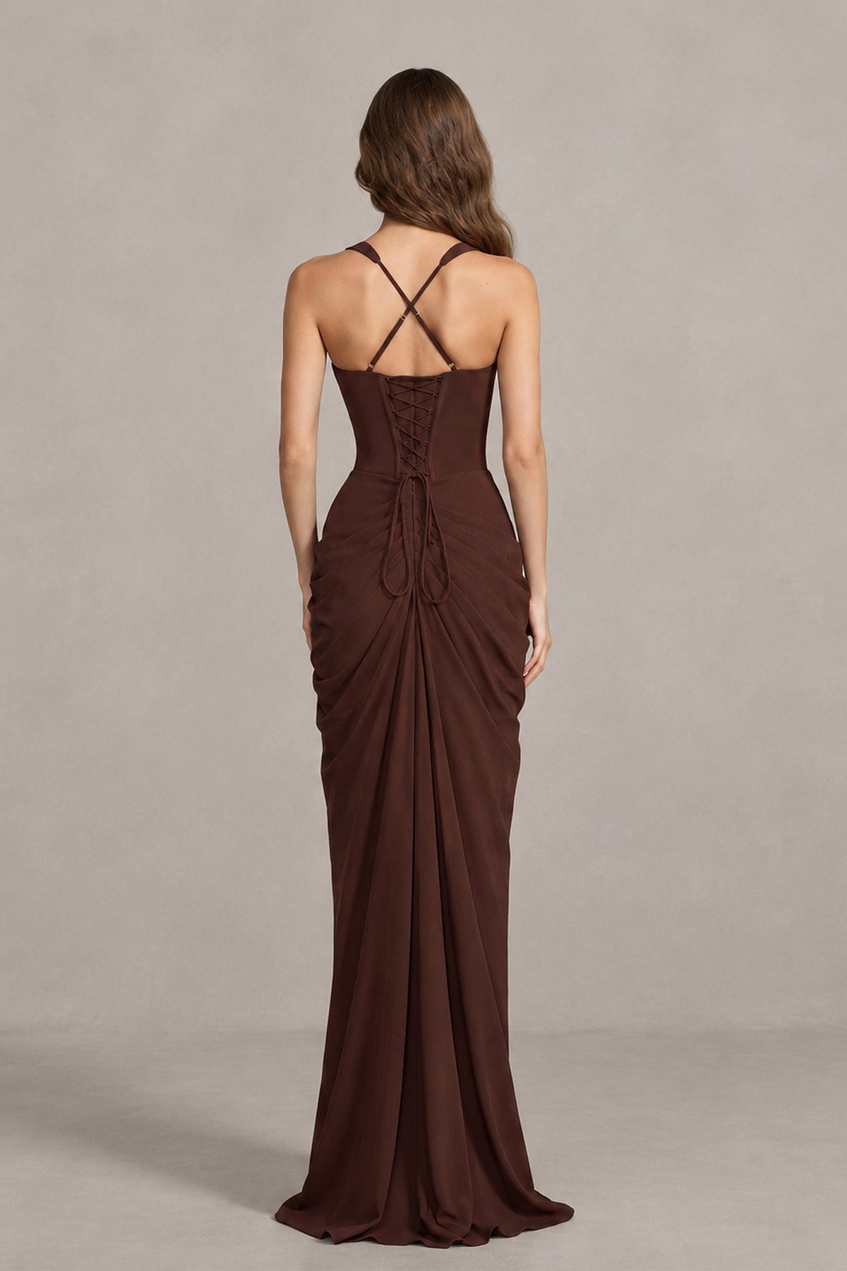Back view of BOLODOO brown maxi dress showing crossed straps and lace-up fastening