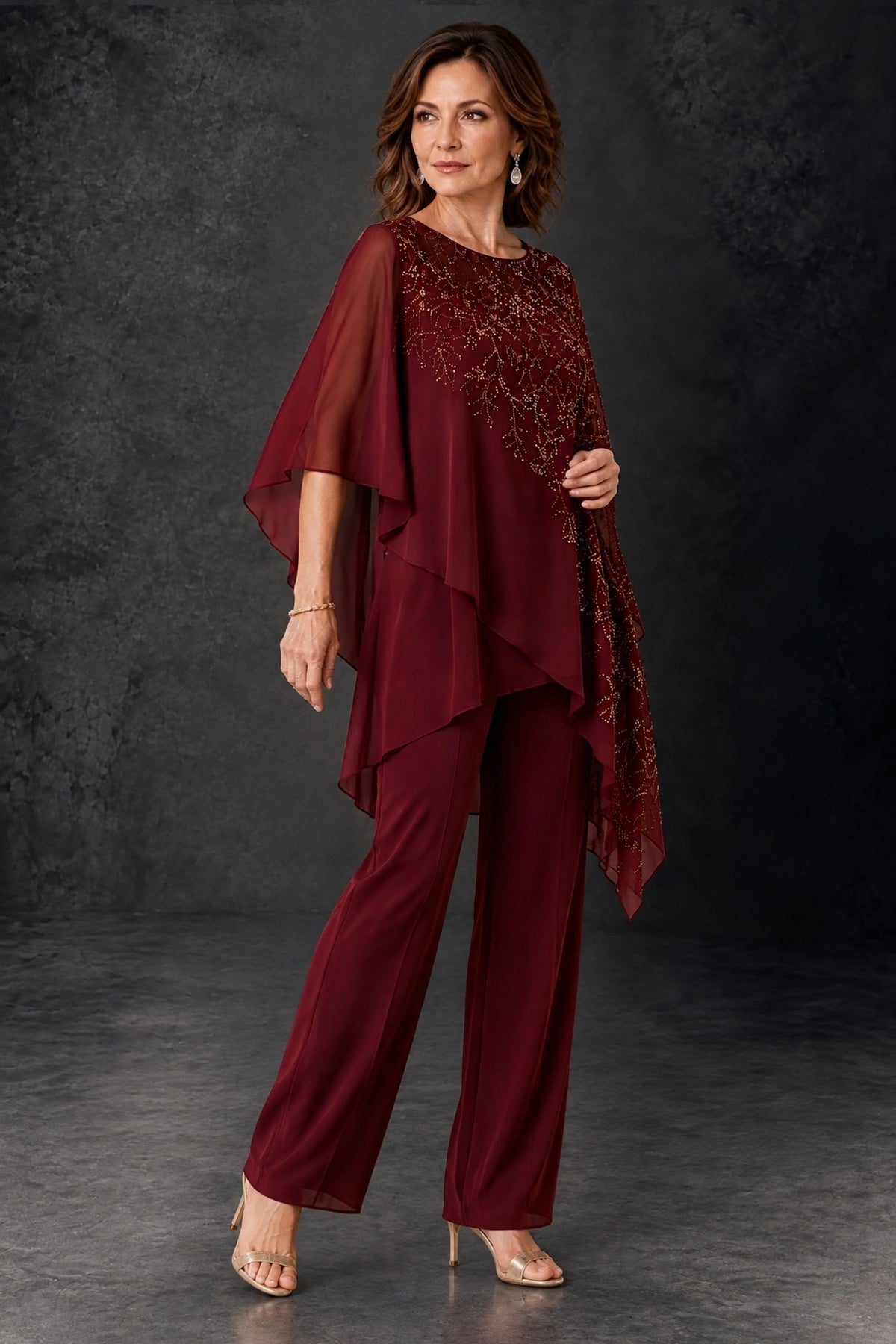 Burgundy formal pant suit, angled full-length view showing flowing cape and ankle-length wide-leg pants