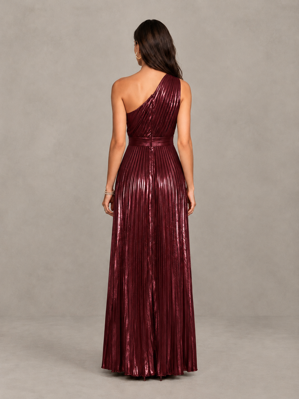 Back view of BOLODOO burgundy pleated maxi dress showing asymmetric back and floor-length skirt