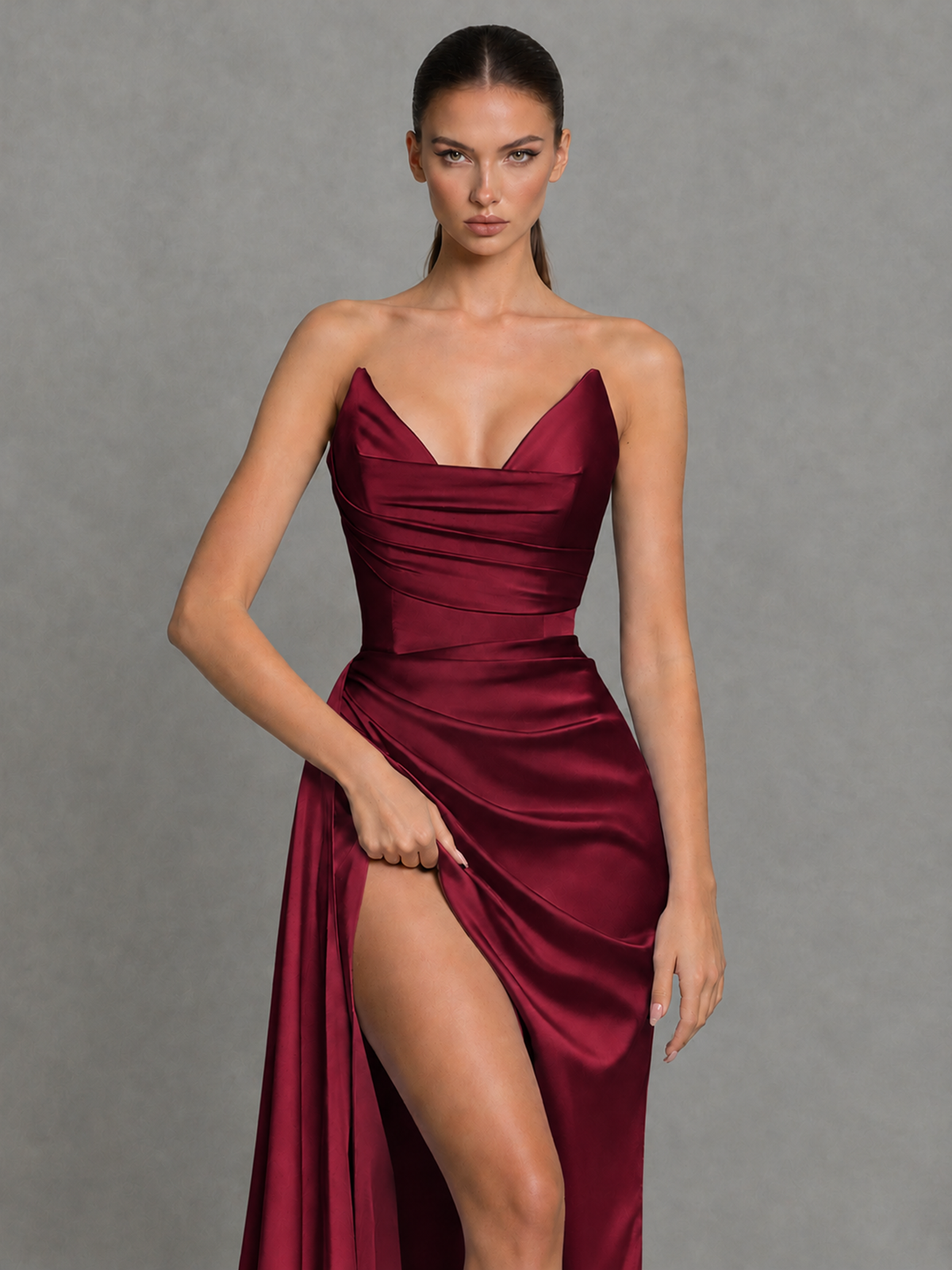 Full front view of BOLODOO burgundy ruched strapless high-slit evening dress