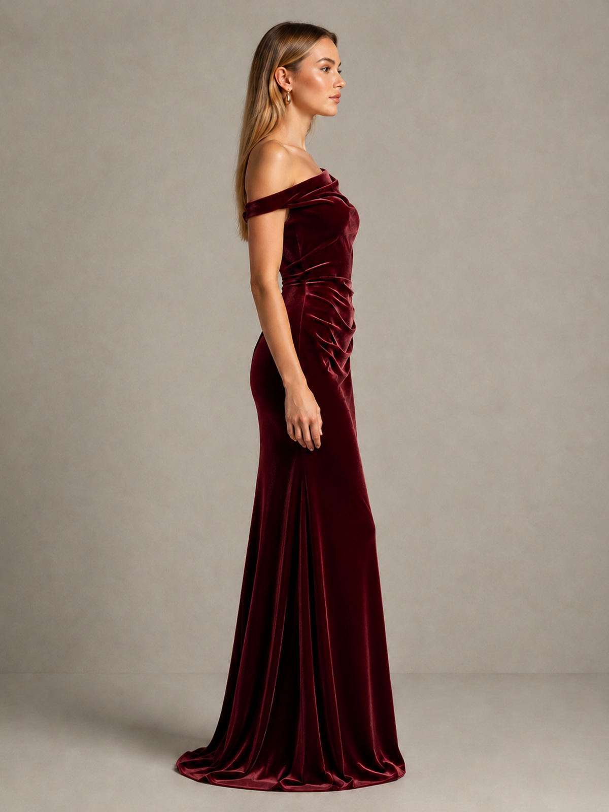 Burgundy floor-length velvet mermaid gown side view with sweep train