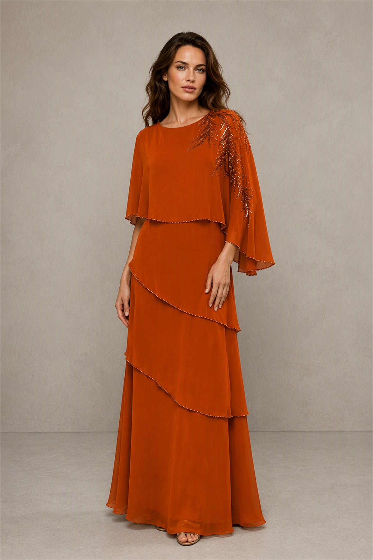 BOLODOO Burnt Orange Mocha Asymmetric Cape Sleeve Burnt Orange Sequin Embroidered Pearl Trim Tiered Chiffon Gown - Burnt Orange