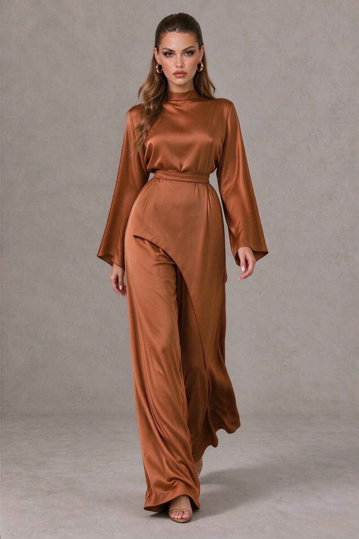 BOLODOO QQ076 burnt orange full-length jumpsuit showing wide-leg movement and asymmetric waist overlay