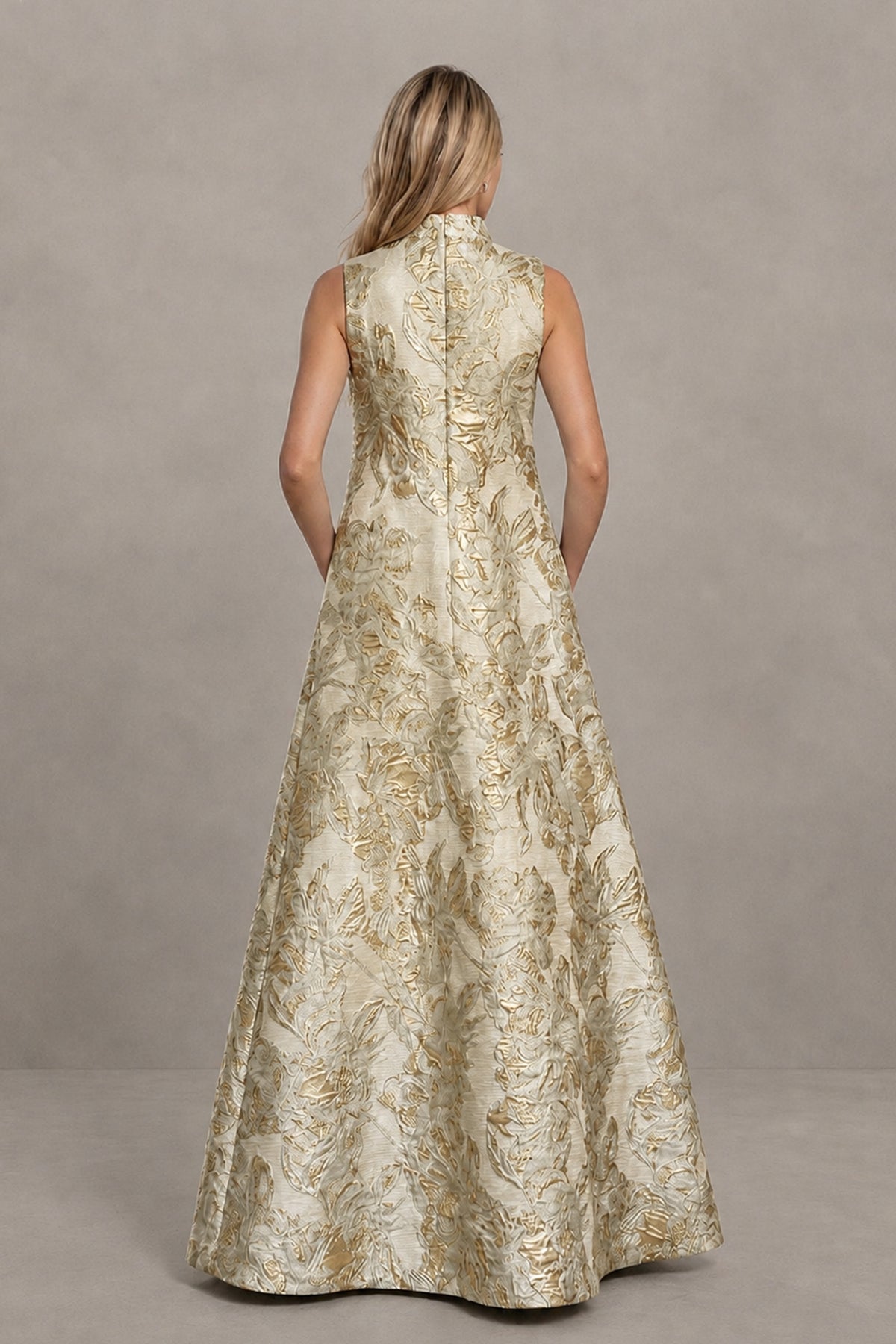 Back view of the champagne gold floral jacquard sleeveless maxi dress showing covered back with concealed zipper