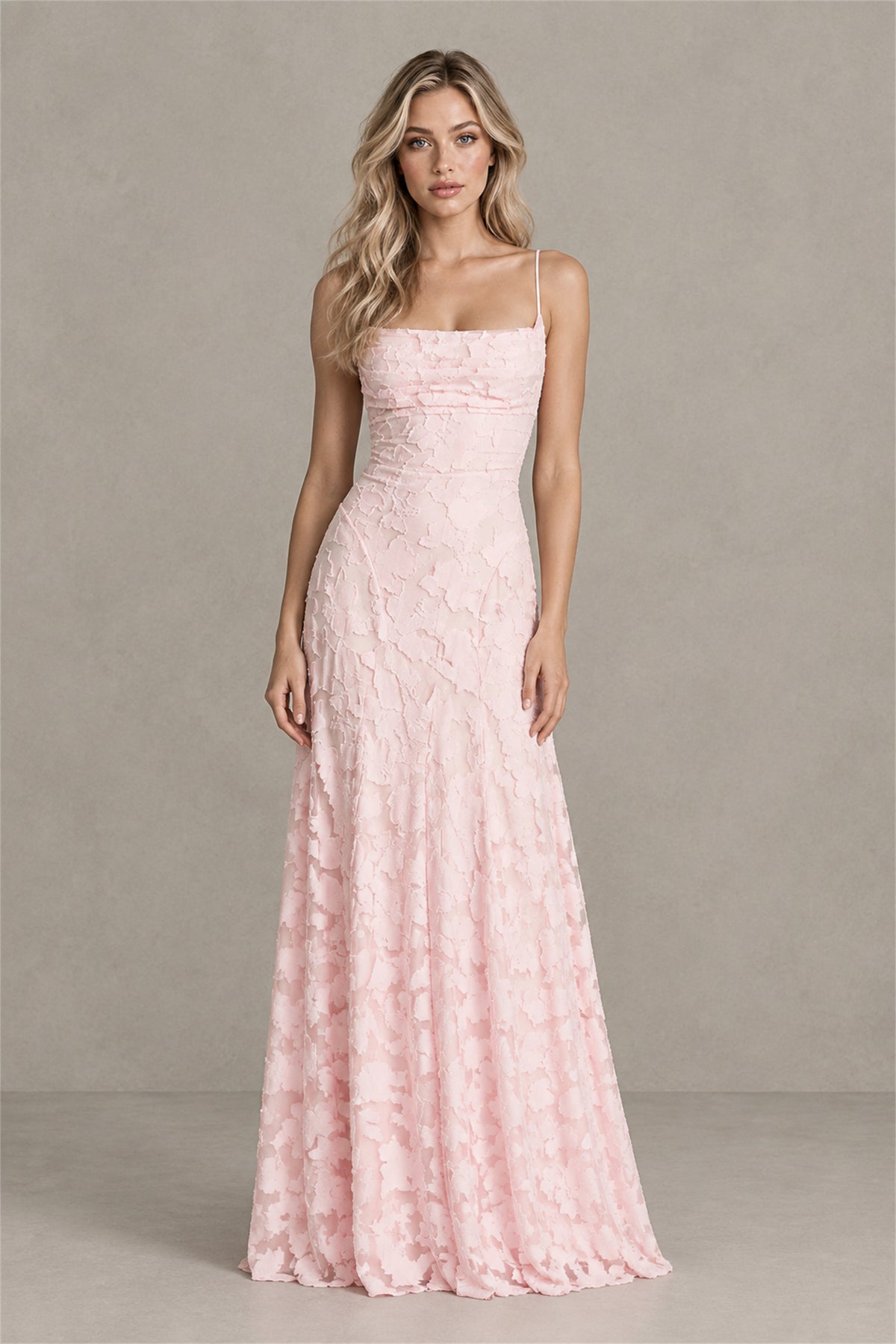 Three quarter view showing open lace-up back of BOLODOO blush pink maxi dress