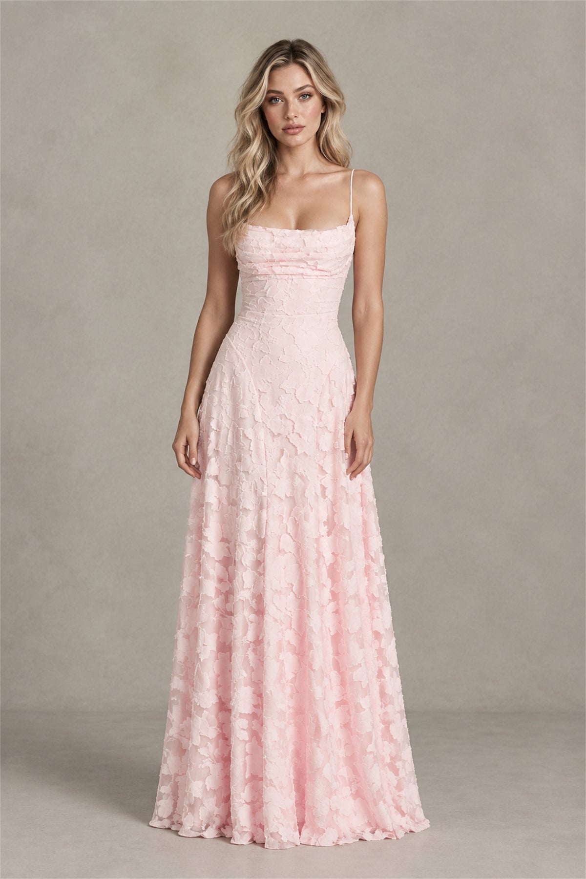 Front view of blush pink A-line formal maxi dress with floral textured overlay