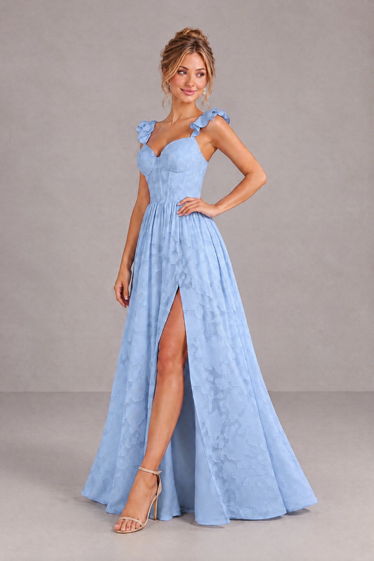 BOLODOO floral-textured dusty blue gown three-quarter view showing fitted bodice and slit