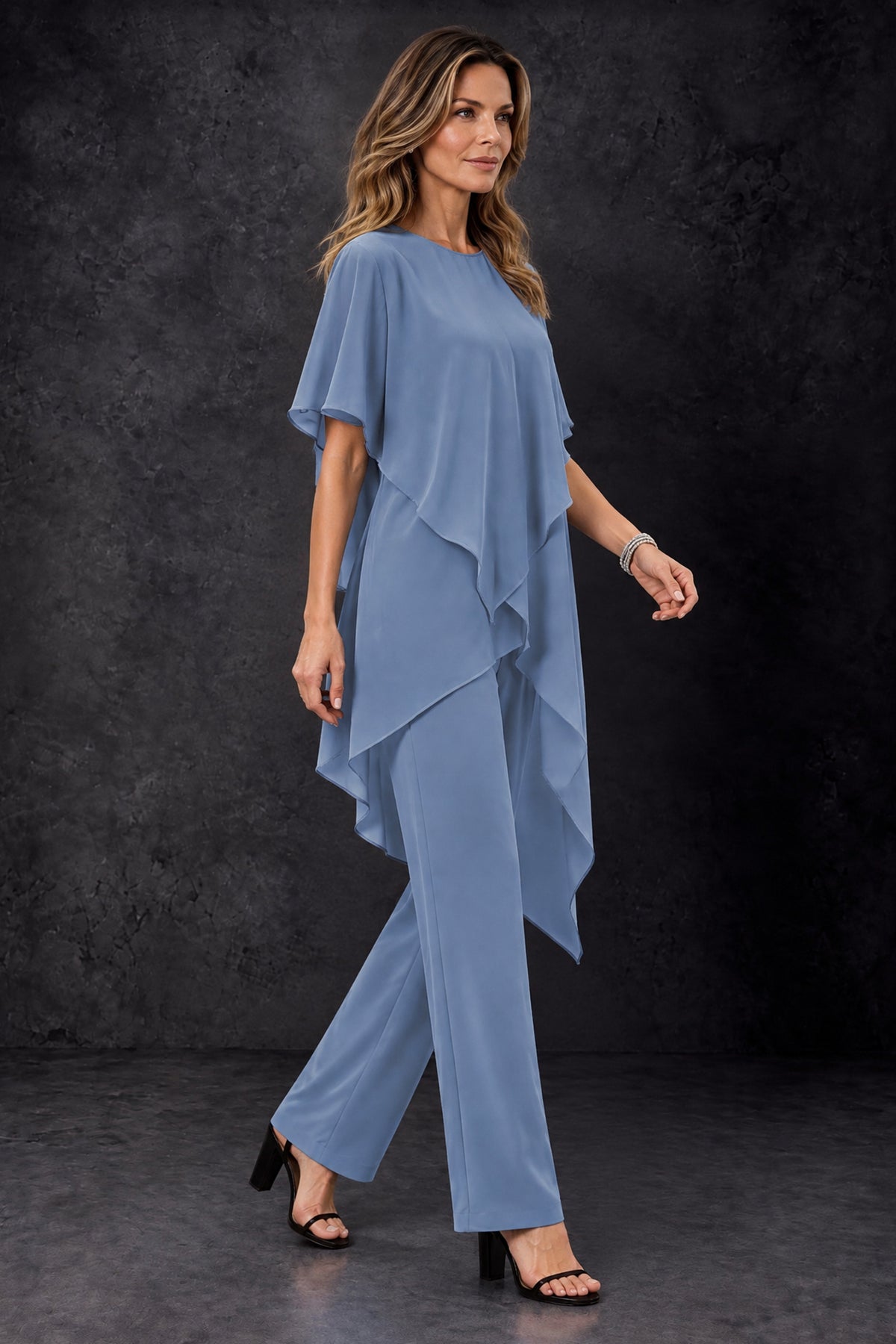 Side view of the BOLODOO dusty blue two piece chiffon pant suit with flowing layered top and full-length wide-leg trousers