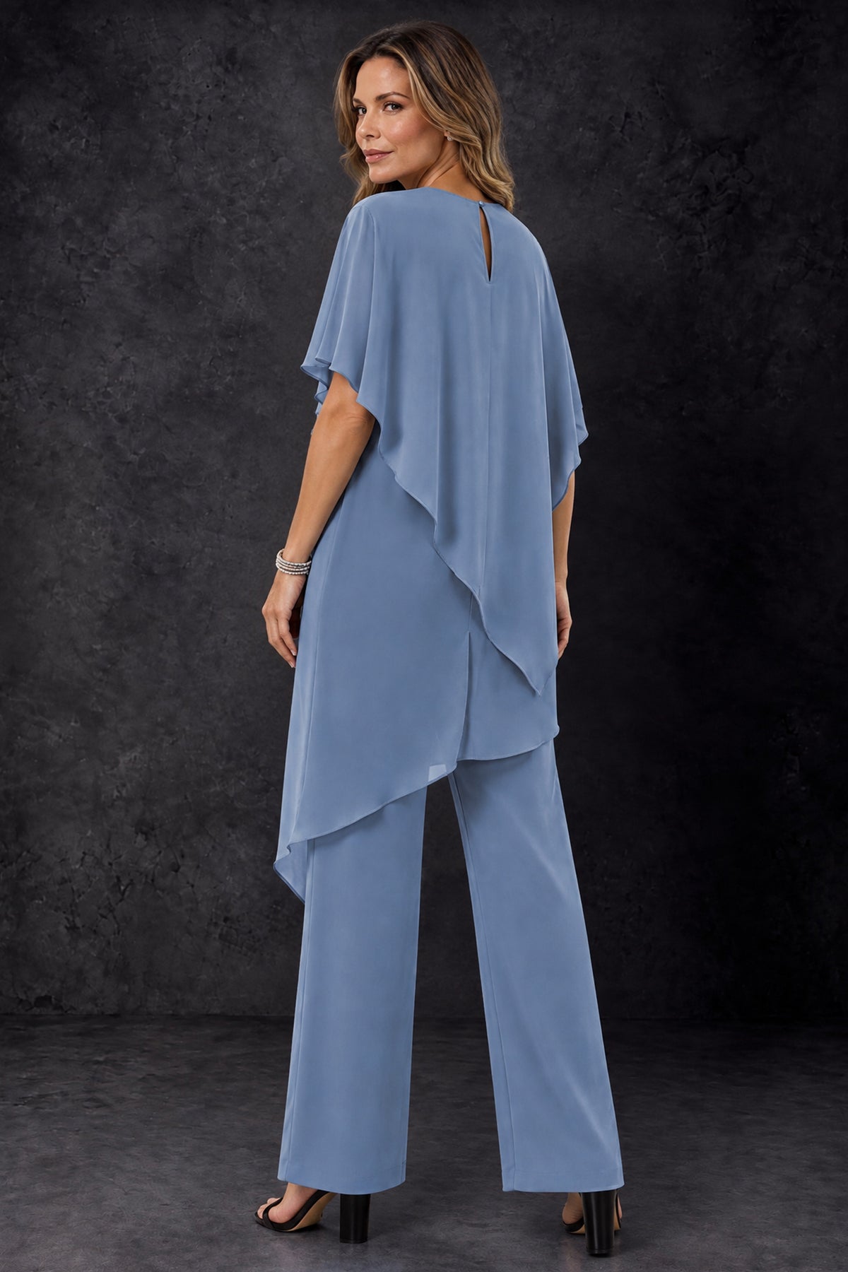 Back view of the BOLODOO dusty blue mother of the bride pant suit with keyhole back detail and draped chiffon layers