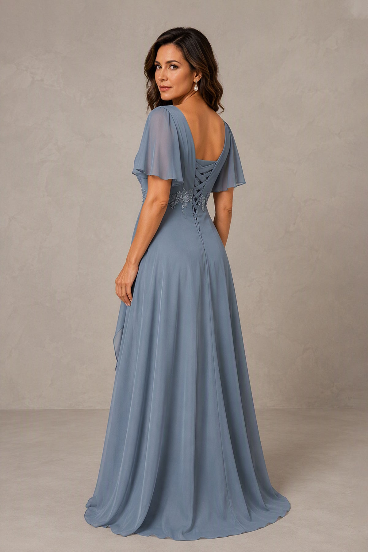 Dusty blue chiffon V-neck evening gown with short flutter sleeves and beaded floral waist applique, front view