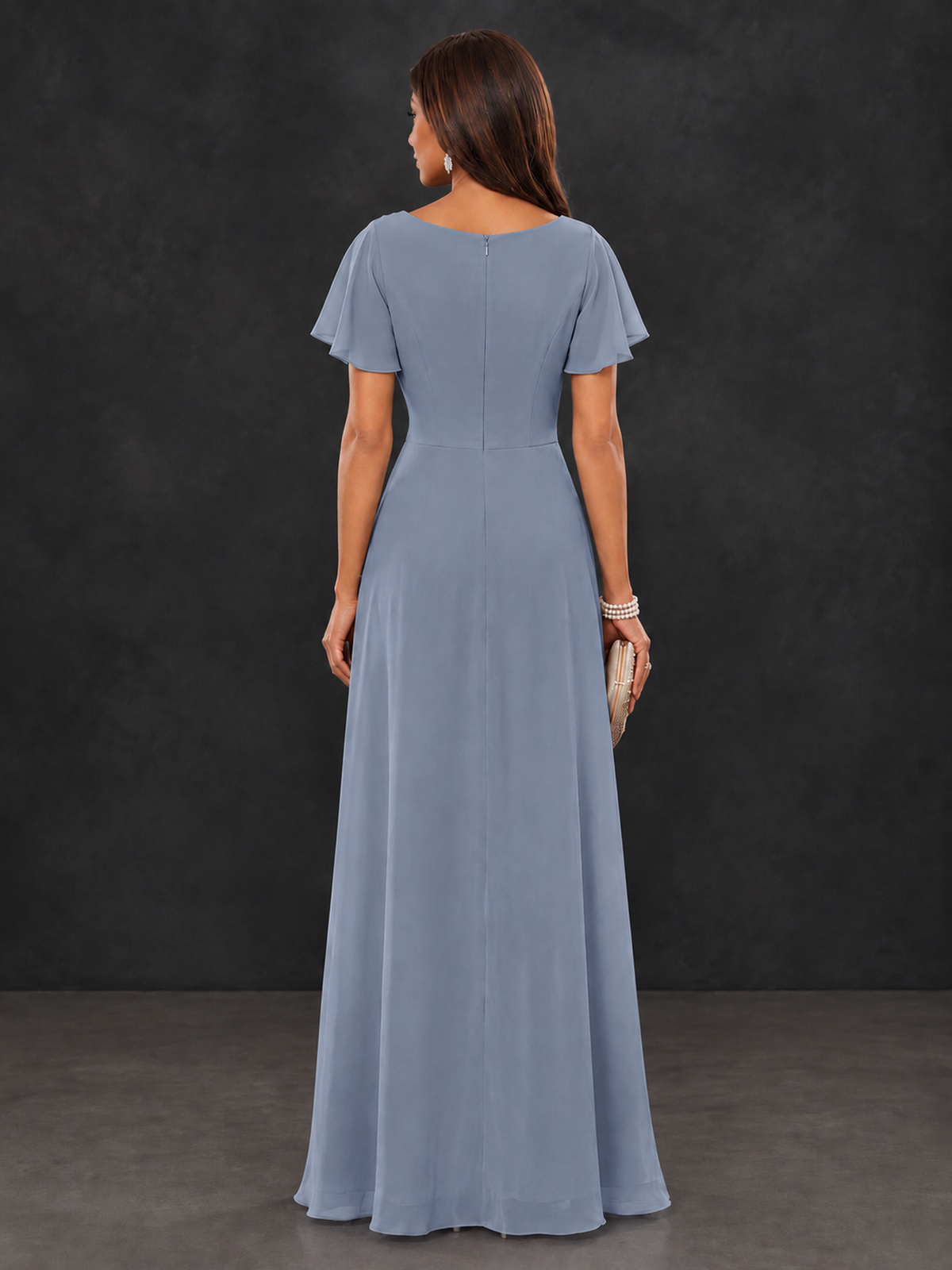 Back view of dusty blue formal maxi dress showing covered back and short flutter sleeves