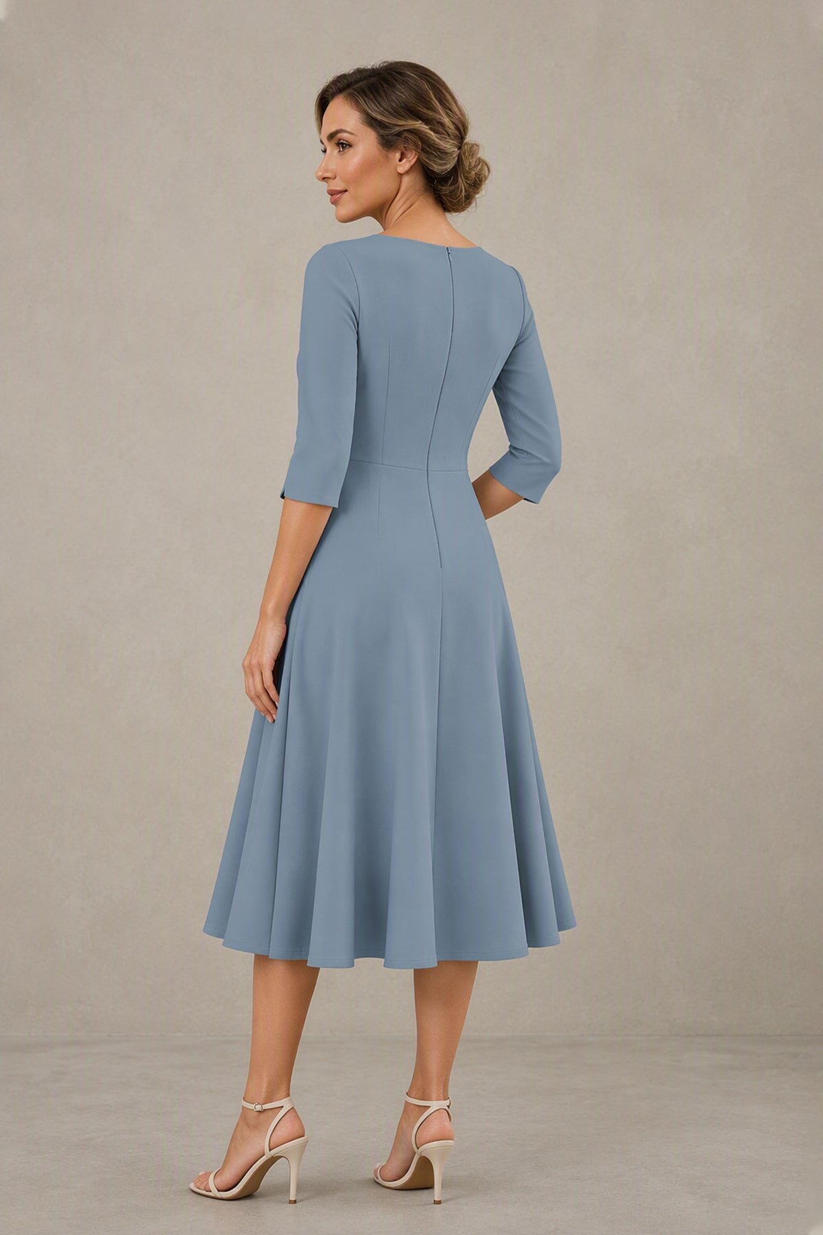 Back view of dusty blue 3/4 sleeve midi dress with covered back and seamed bodice