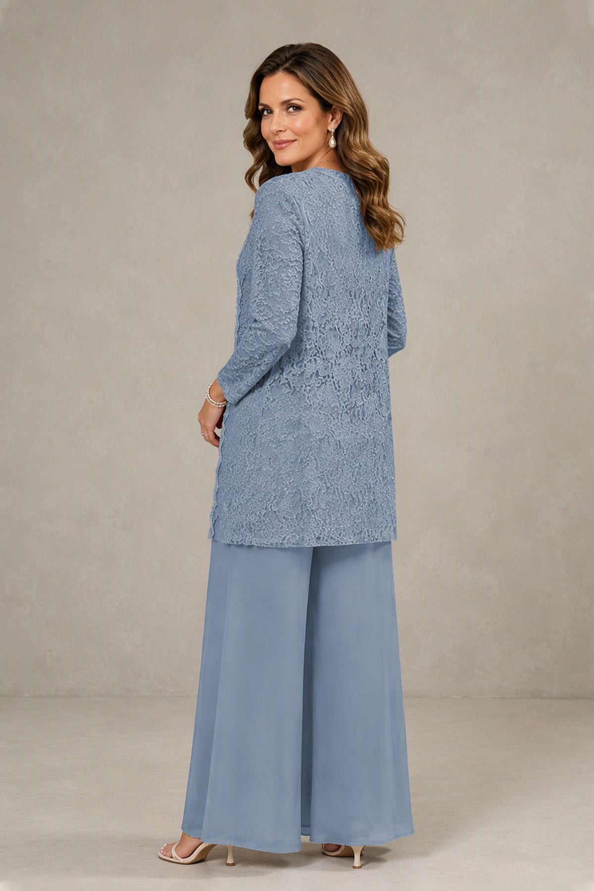 Back view of dusty blue lace jacket pantsuit, covered back design with 3/4 sleeves and full-length wide-leg pants