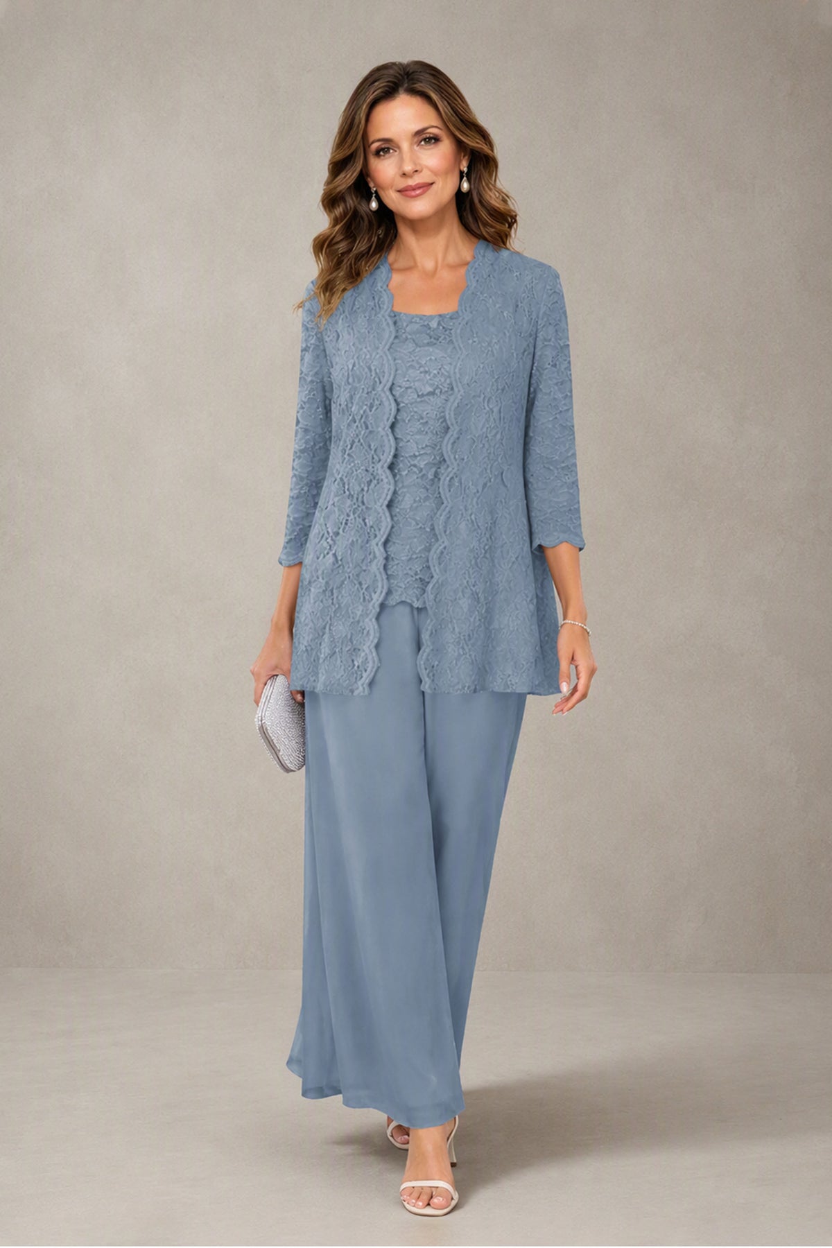 Dusty blue lace jacket and chiffon wide leg pants, walking view showing the flowy floor-length silhouette for wedding guests