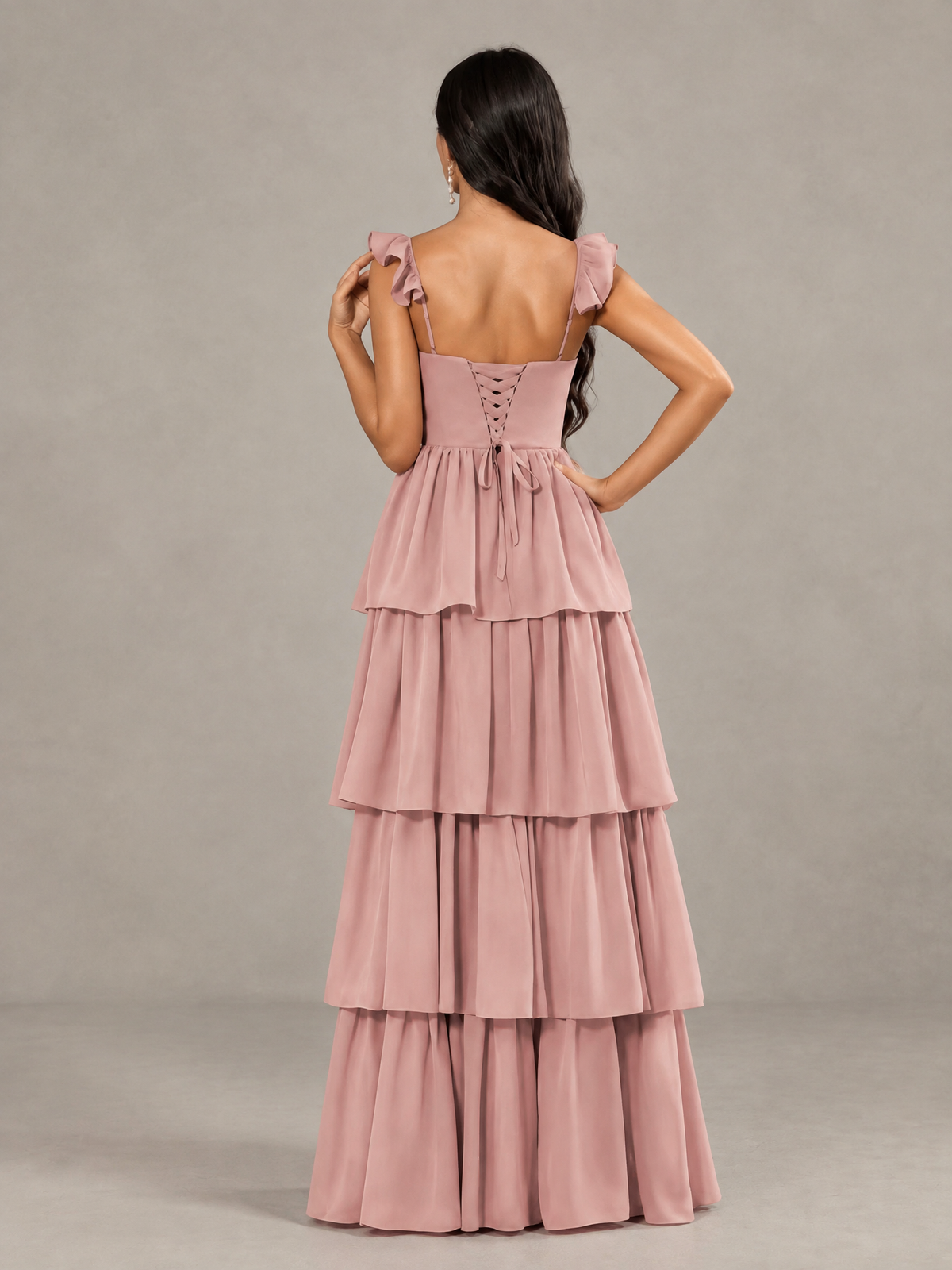 Dusty rose bridesmaid maxi dress with lace-up open back and tiered skirt, back view