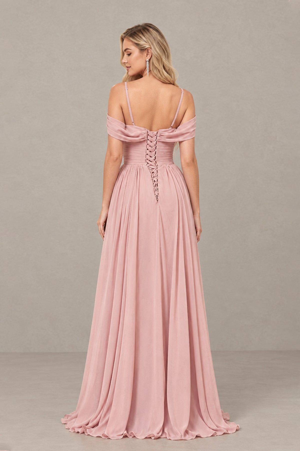 Front view of BOLODOO dusty rose floor-length bridesmaid dress with bouquet and slit