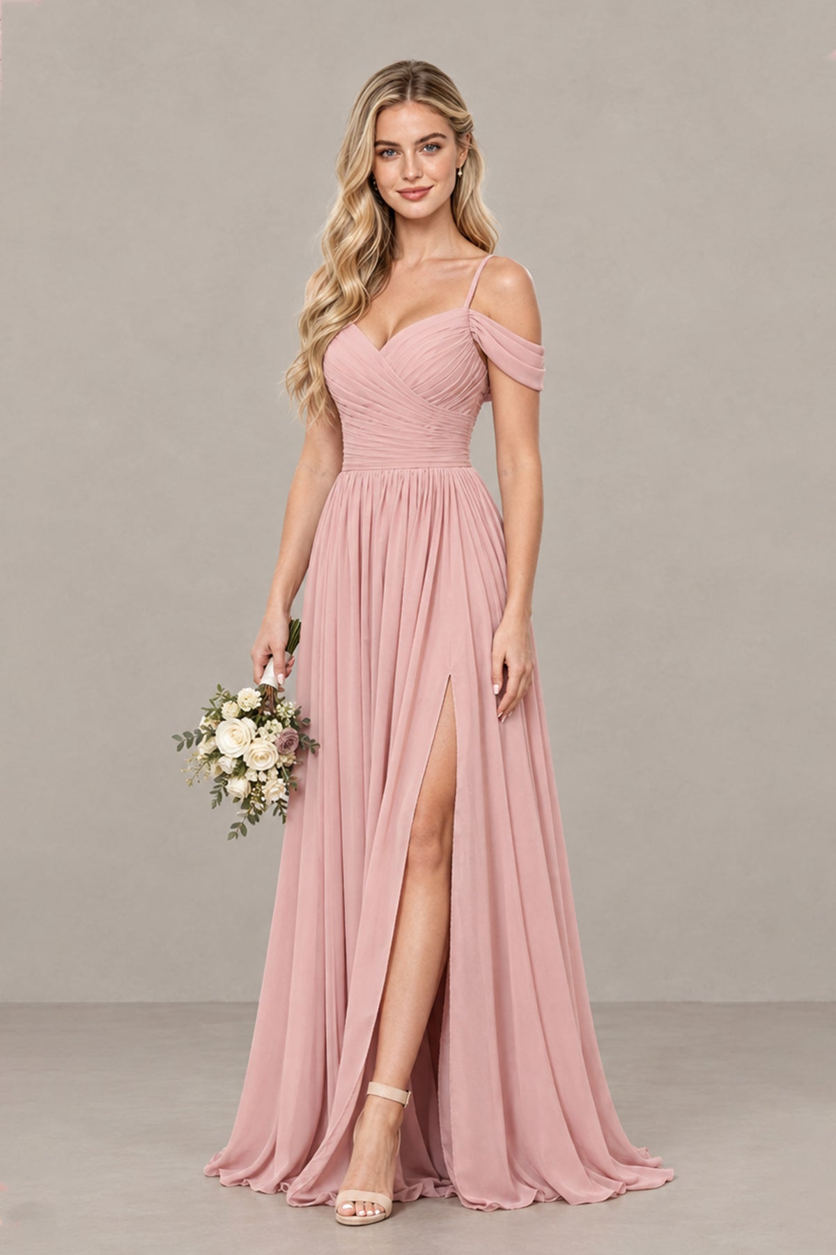 Dusty rose A-line bridesmaid gown with sweetheart neckline, draped sleeves and slit, angled front view