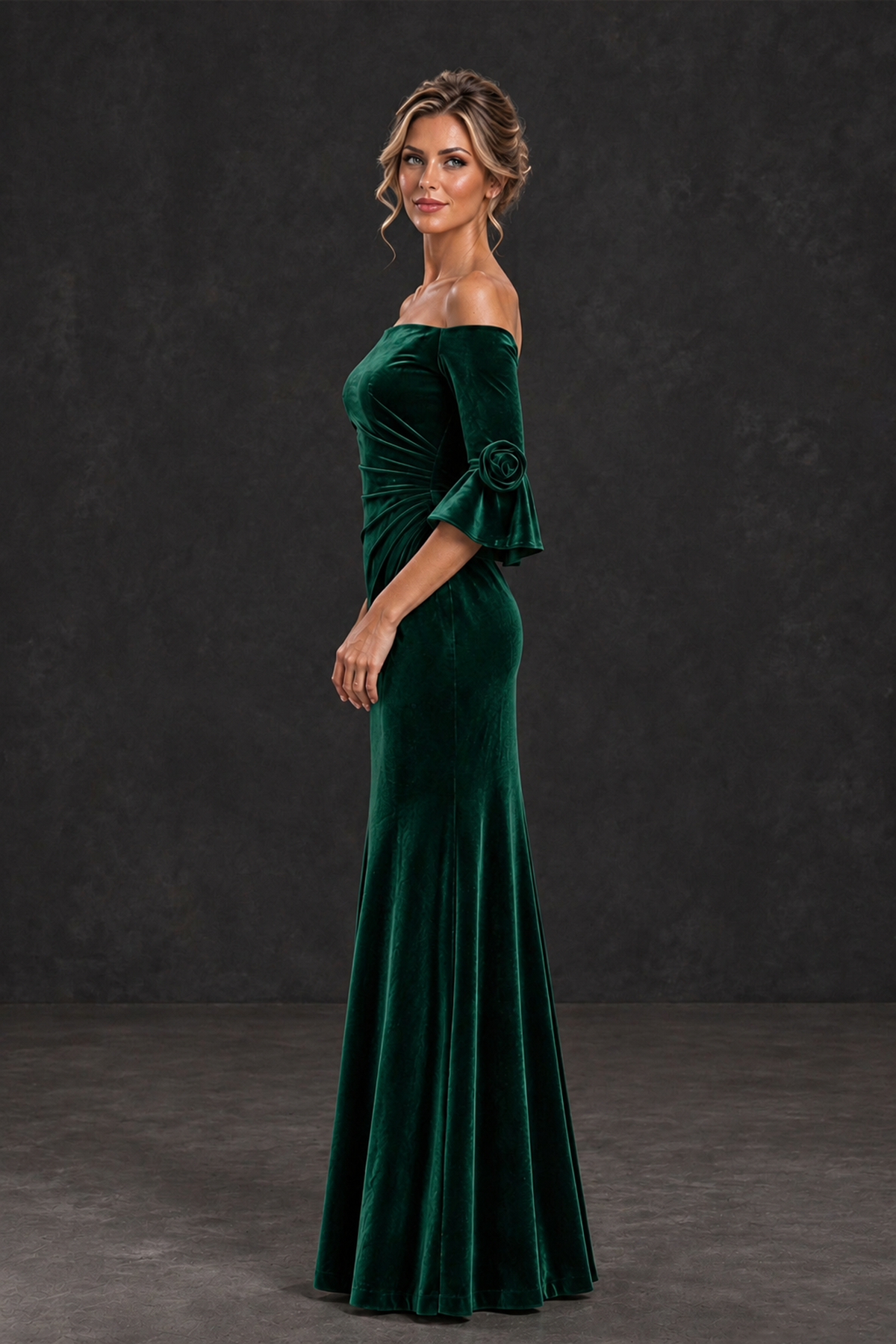 Emerald green velvet off-shoulder mermaid gown with 3D floral flounce cuffs, three-quarter side view, BOLODOO