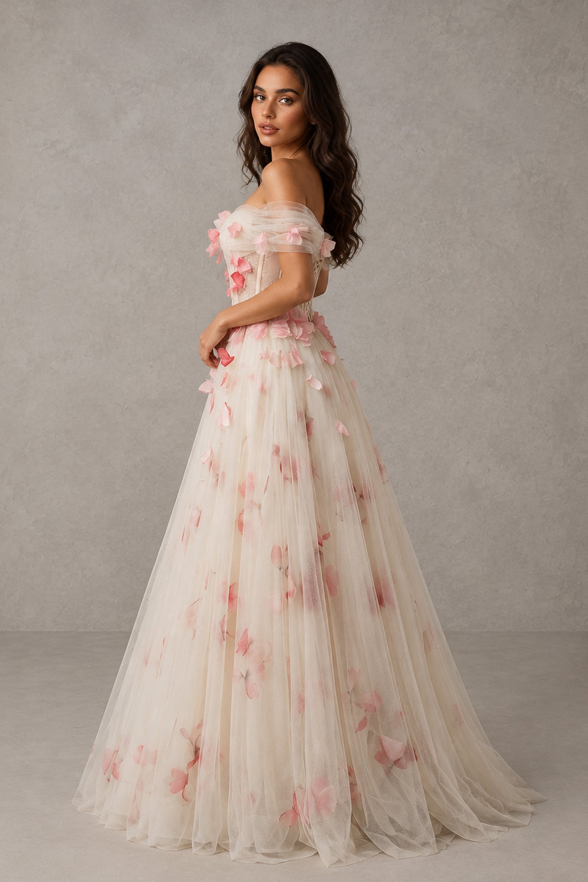 Ivory and pink floral gown with draped short sleeves and layered sheer skirt, side view