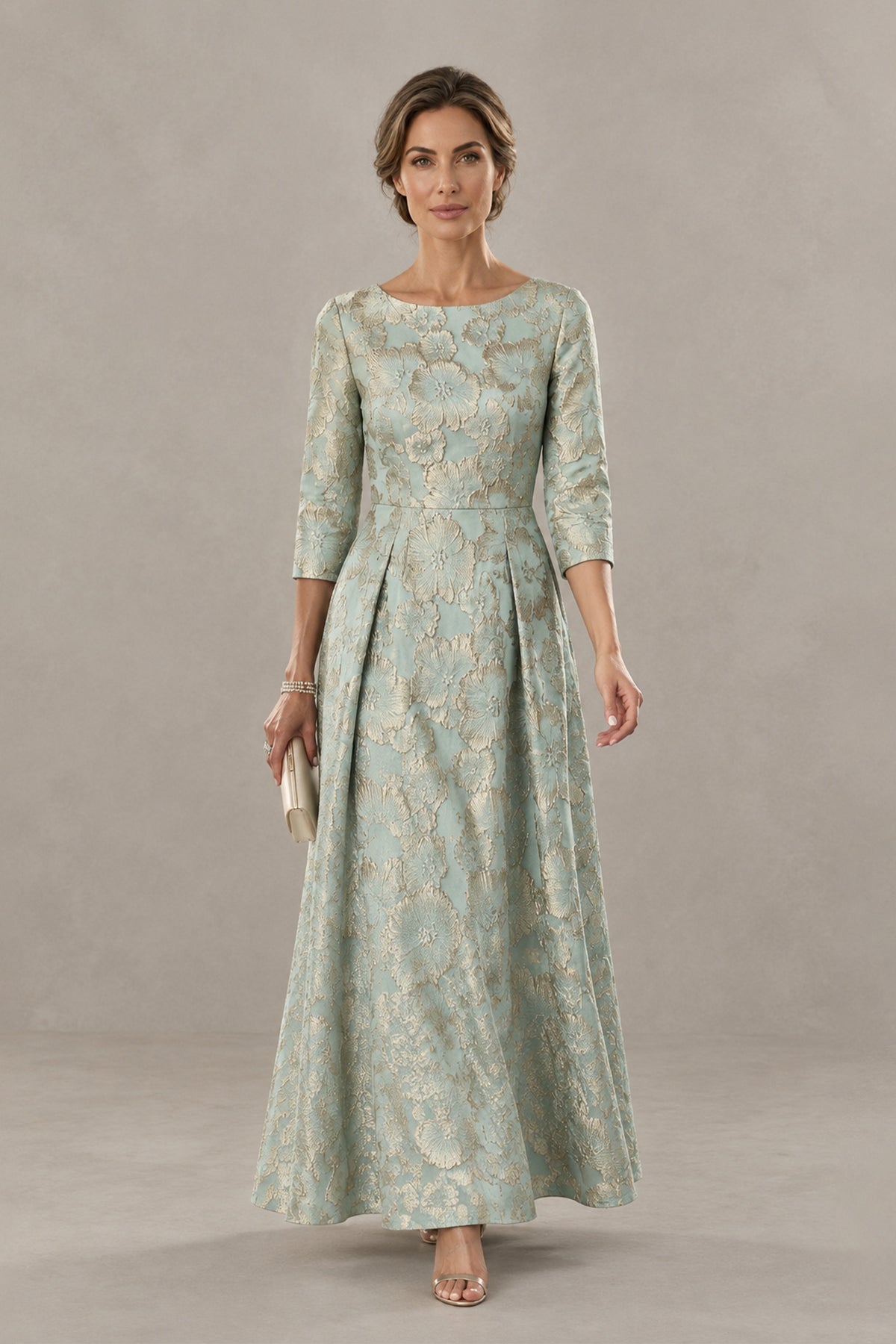 BOLODOO sage green floral jacquard midi dress three-quarter view showing the defined waist and pleated skirt