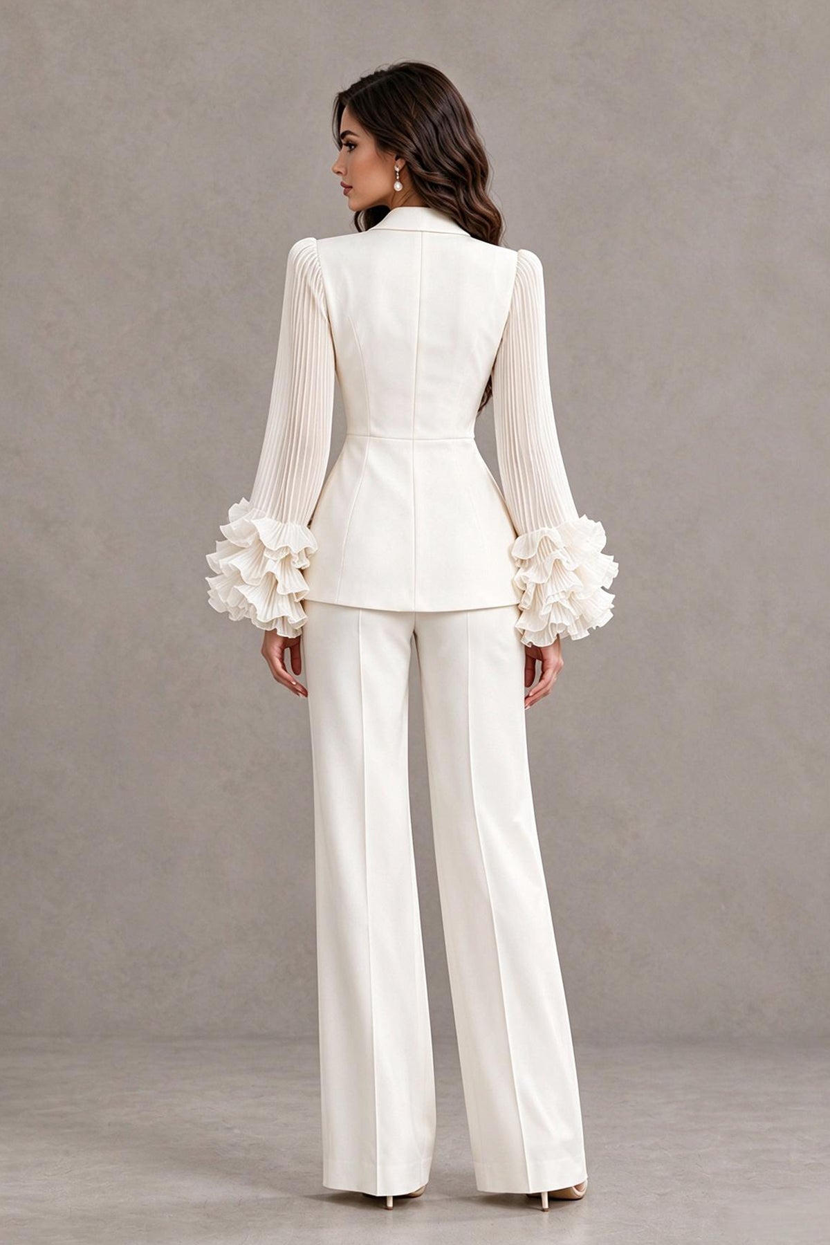 Back view of BOLODOO ivory mother of the bride pant suit with pleated sleeves and ruffle cuffs